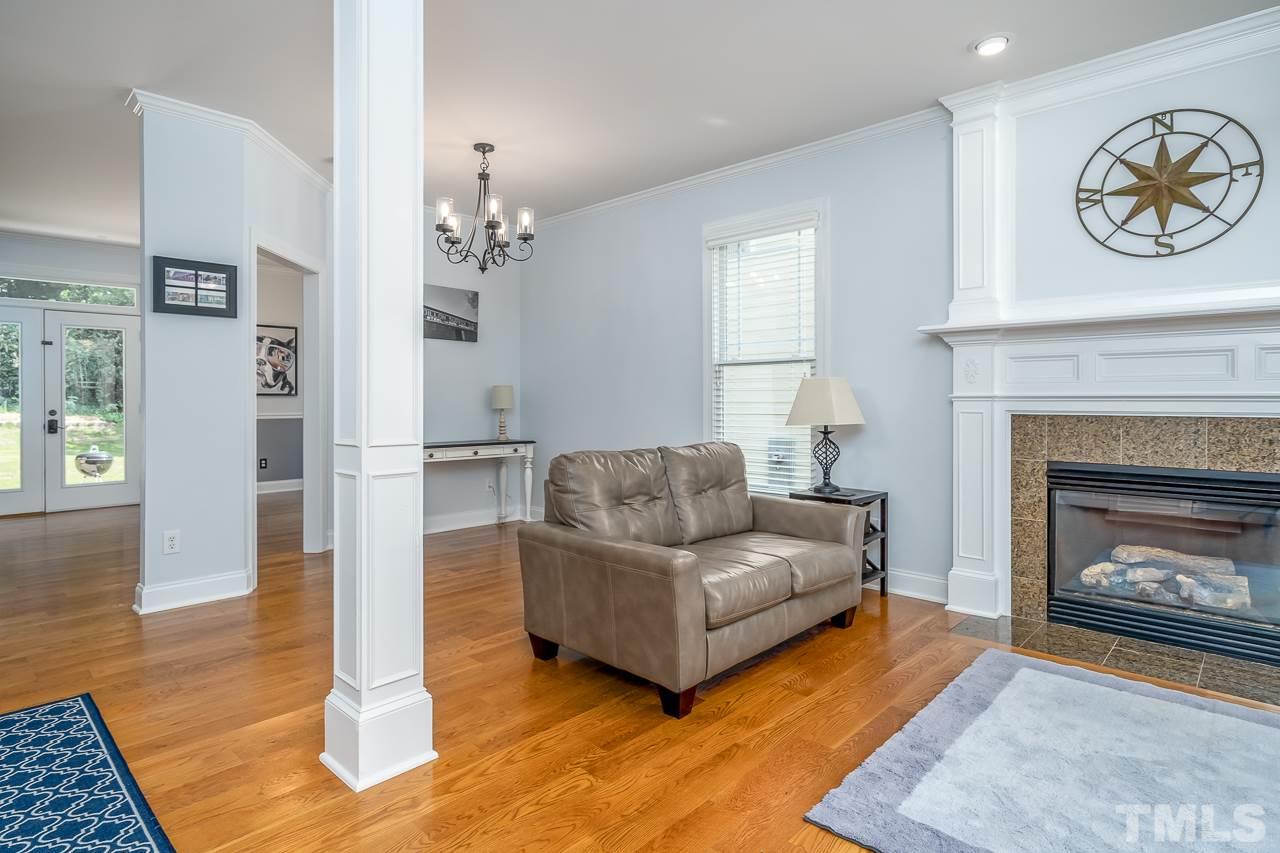 535 Pace Street Raleigh, NC 27604 - Photo 4 of 25 a living room with furniture and a fireplace