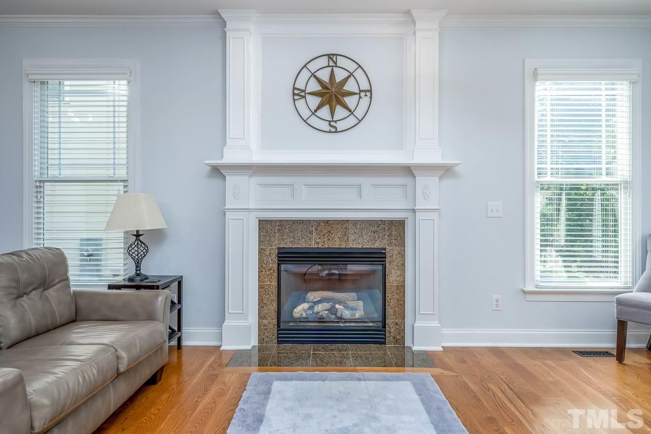 535 Pace Street Raleigh, NC 27604 - Photo 6 of 25 a living room with furniture and a fireplace