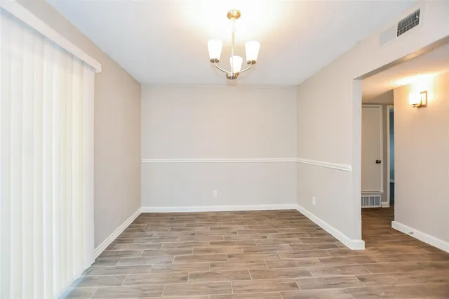 a view of a chandelier in an empty room