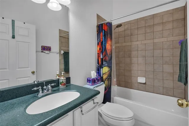 a view of multiple houses with a big yard