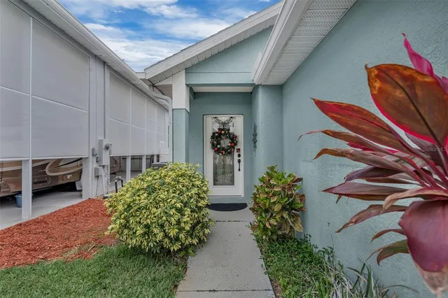 a couple of potted plants in front of a door