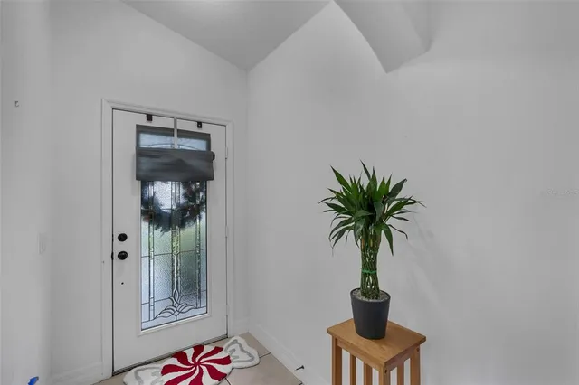 a kitchen with stainless steel appliances granite countertop a sink a stove and a table