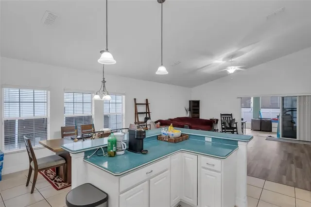 a bed room with a bed a television and fireplace