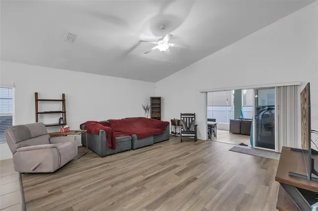 a bedroom with a bed and a flat screen television