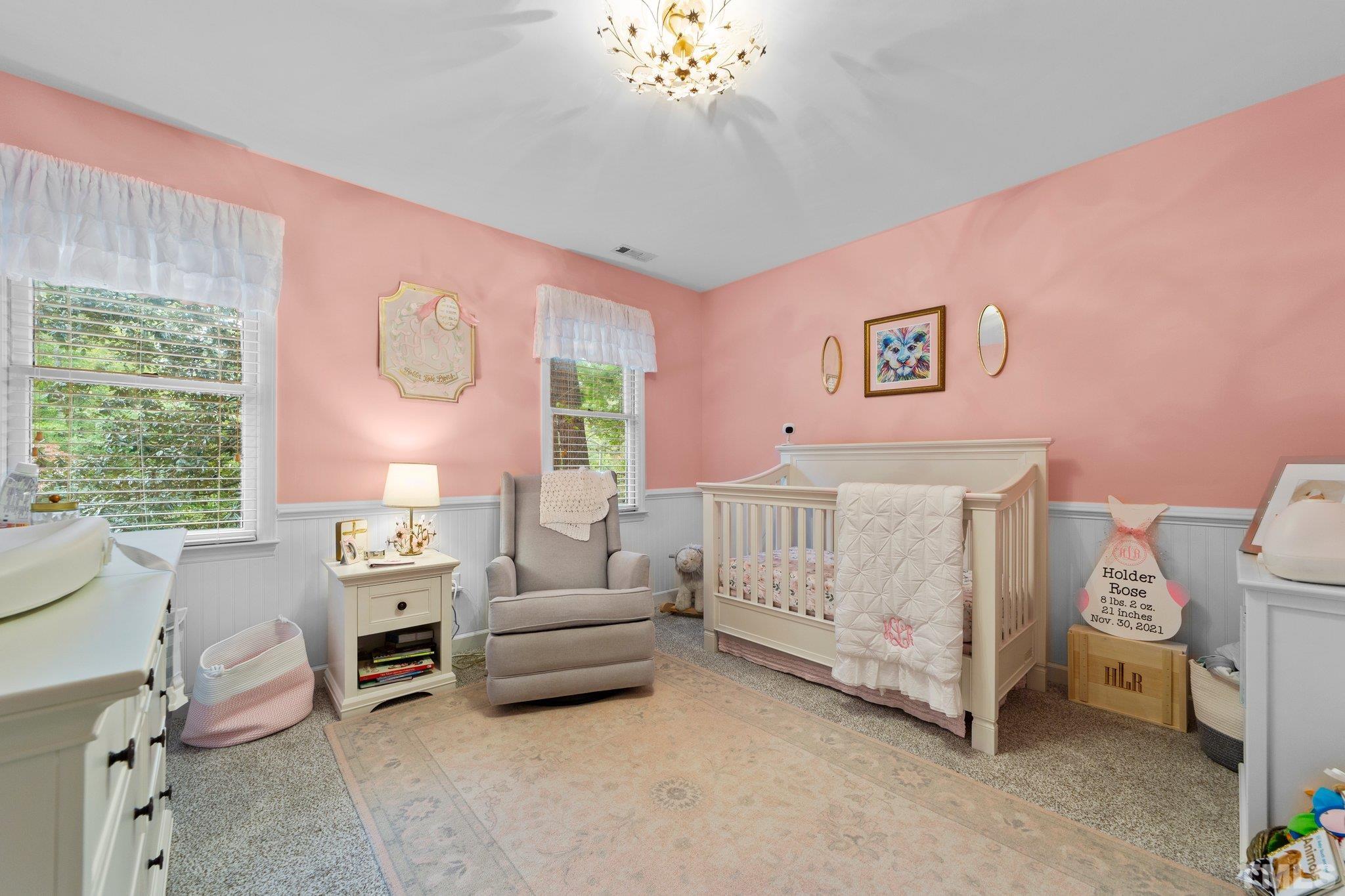 8709 Langtree Lane Raleigh, NC 27613 - Photo 26 of 49 a bedroom with furniture and a large window