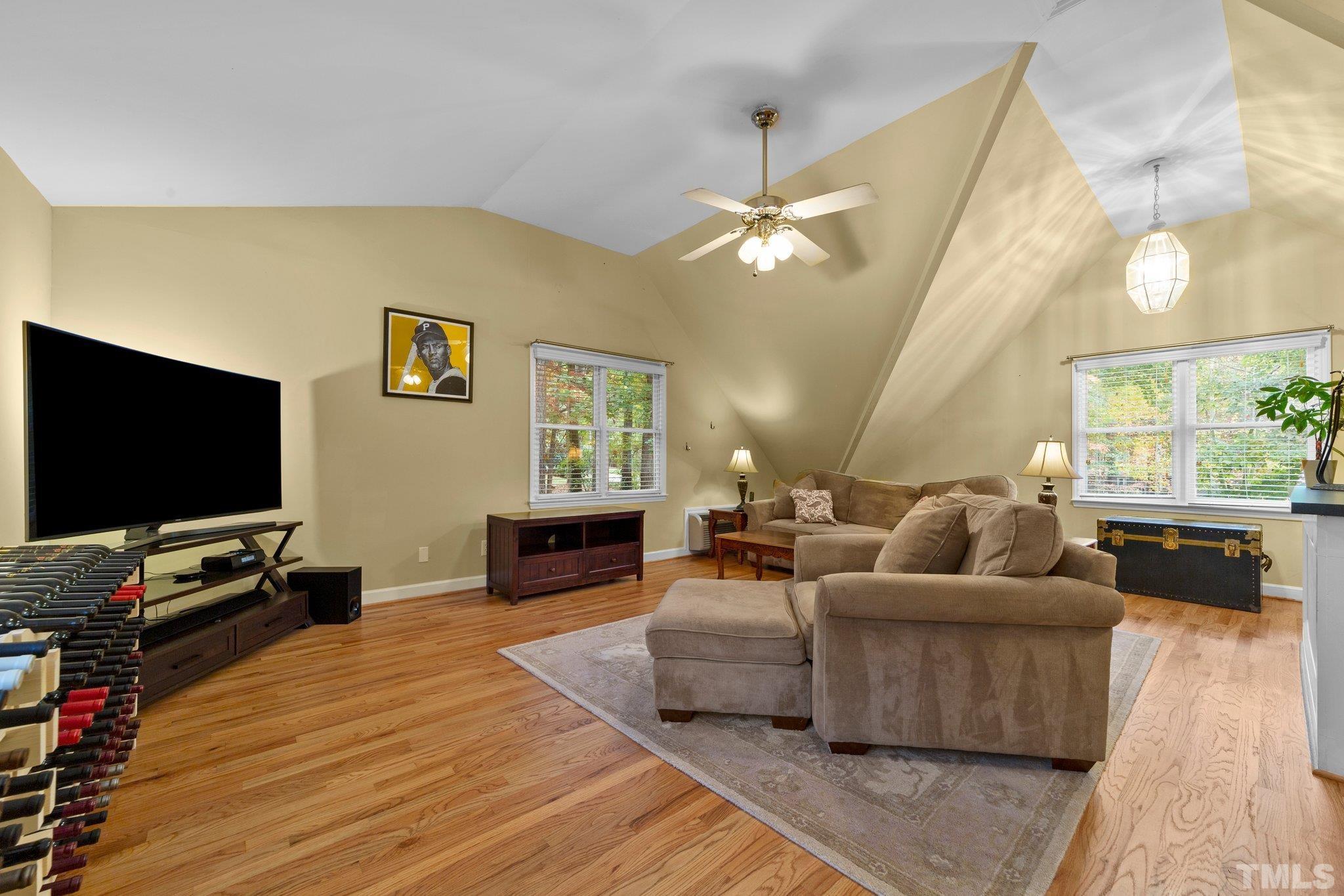 8709 Langtree Lane Raleigh, NC 27613 - Photo 29 of 49 a living room with furniture and a flat screen tv