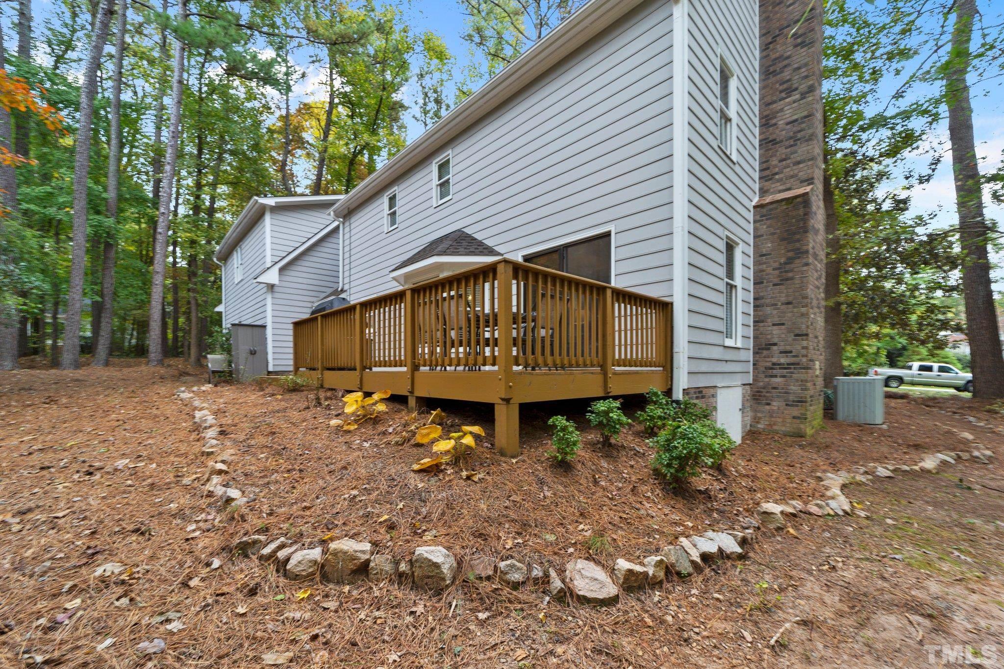 8709 Langtree Lane Raleigh, NC 27613 - Photo 38 of 49 a view of a house with a yard