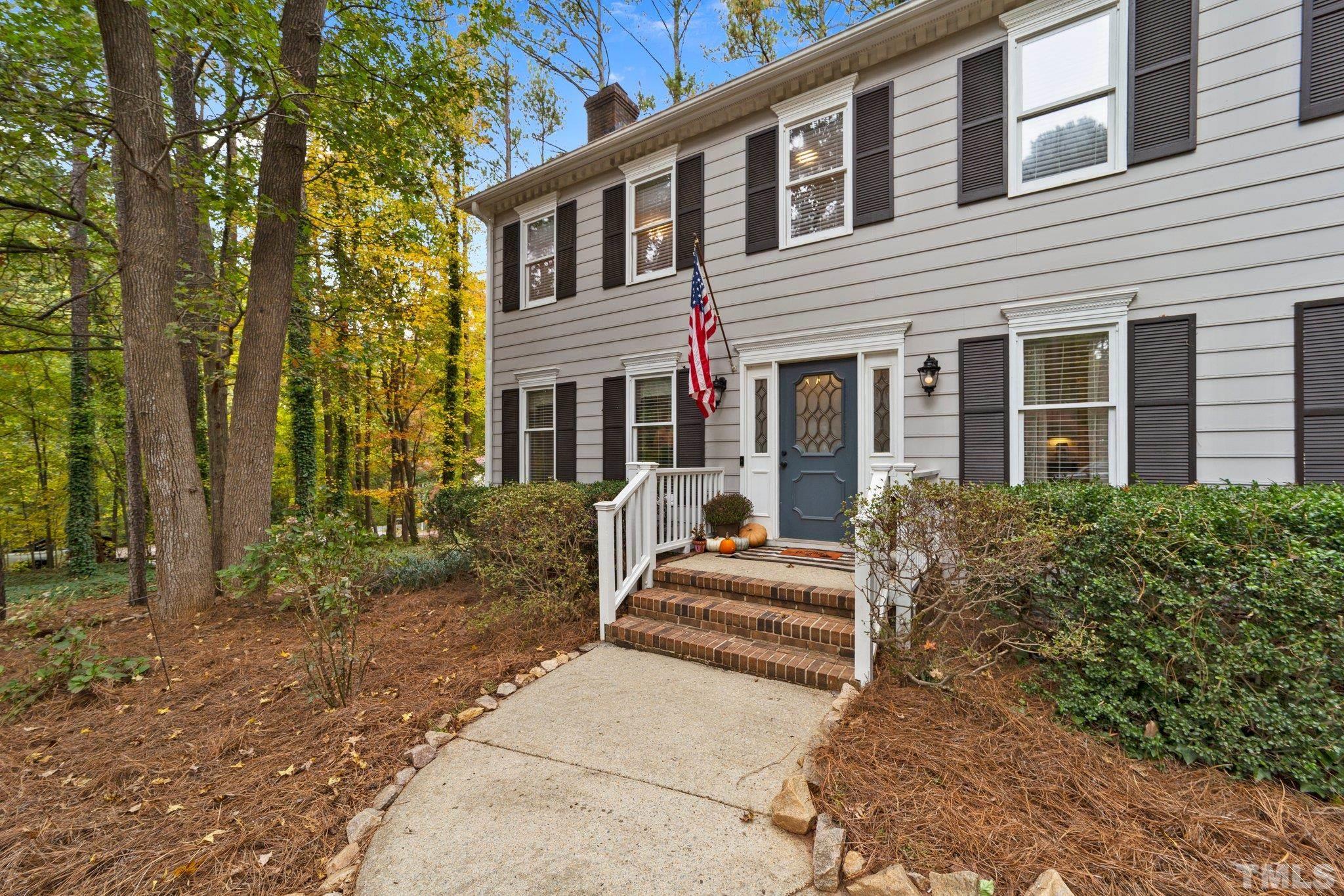 8709 Langtree Lane Raleigh, NC 27613 - Photo 5 of 49 a view of a house with a yard