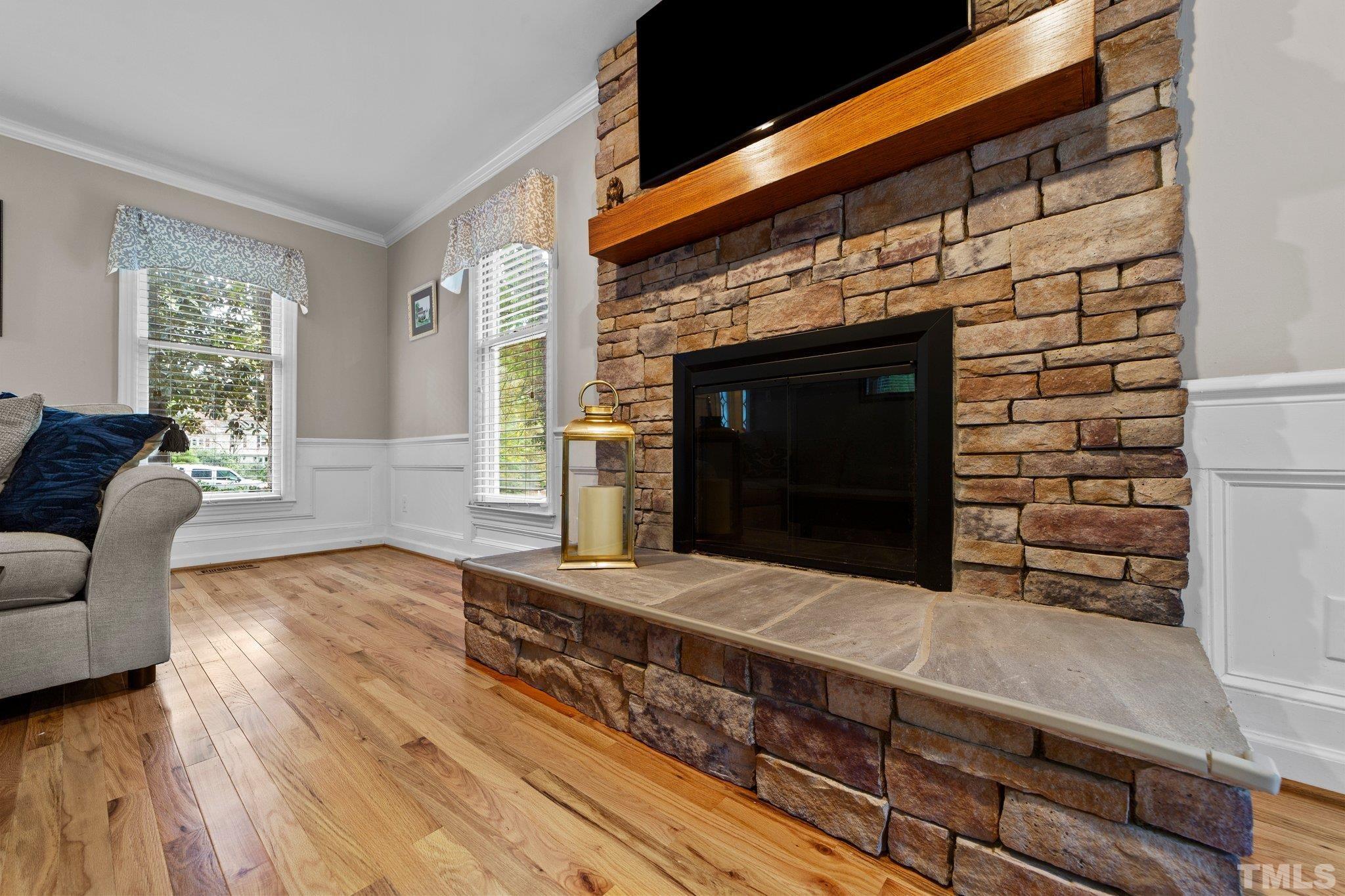 8709 Langtree Lane Raleigh, NC 27613 - Photo 9 of 49 a living room with furniture and a fireplace