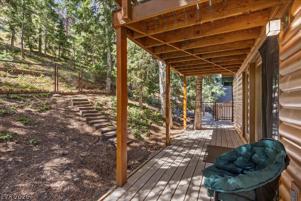 370 Alpine Way Mount Charleston, NV 89124 - Photo 33 of 79 Whimsical, wooded backyard w/access for hiking + exploring right out your back door.