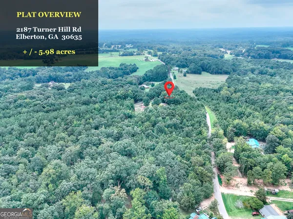 a view of outdoor space with signage and flags