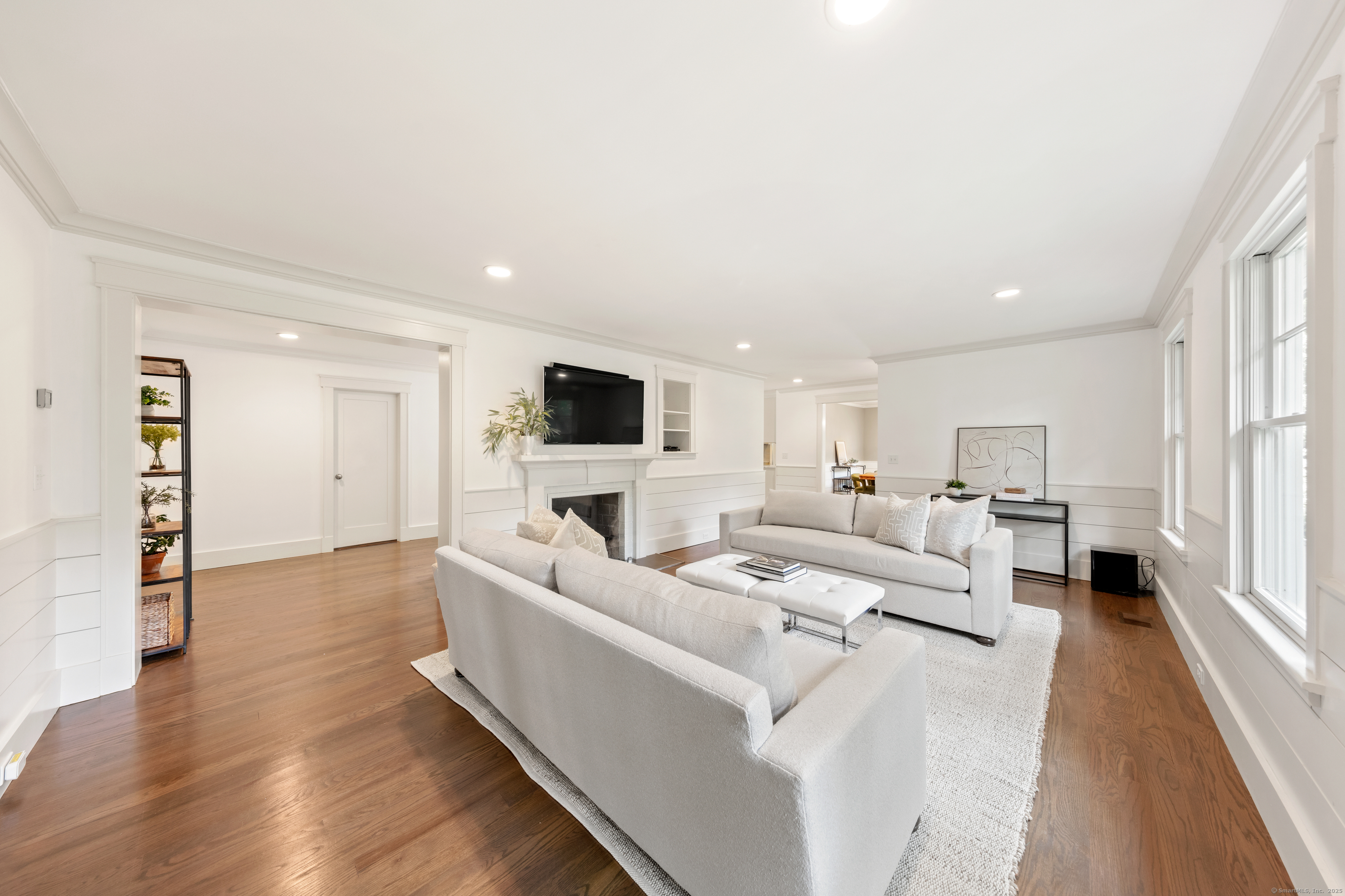 358 Hoyt Street Darien, CT 06820 - Photo 11 of 40 a living room with furniture and a flat screen tv