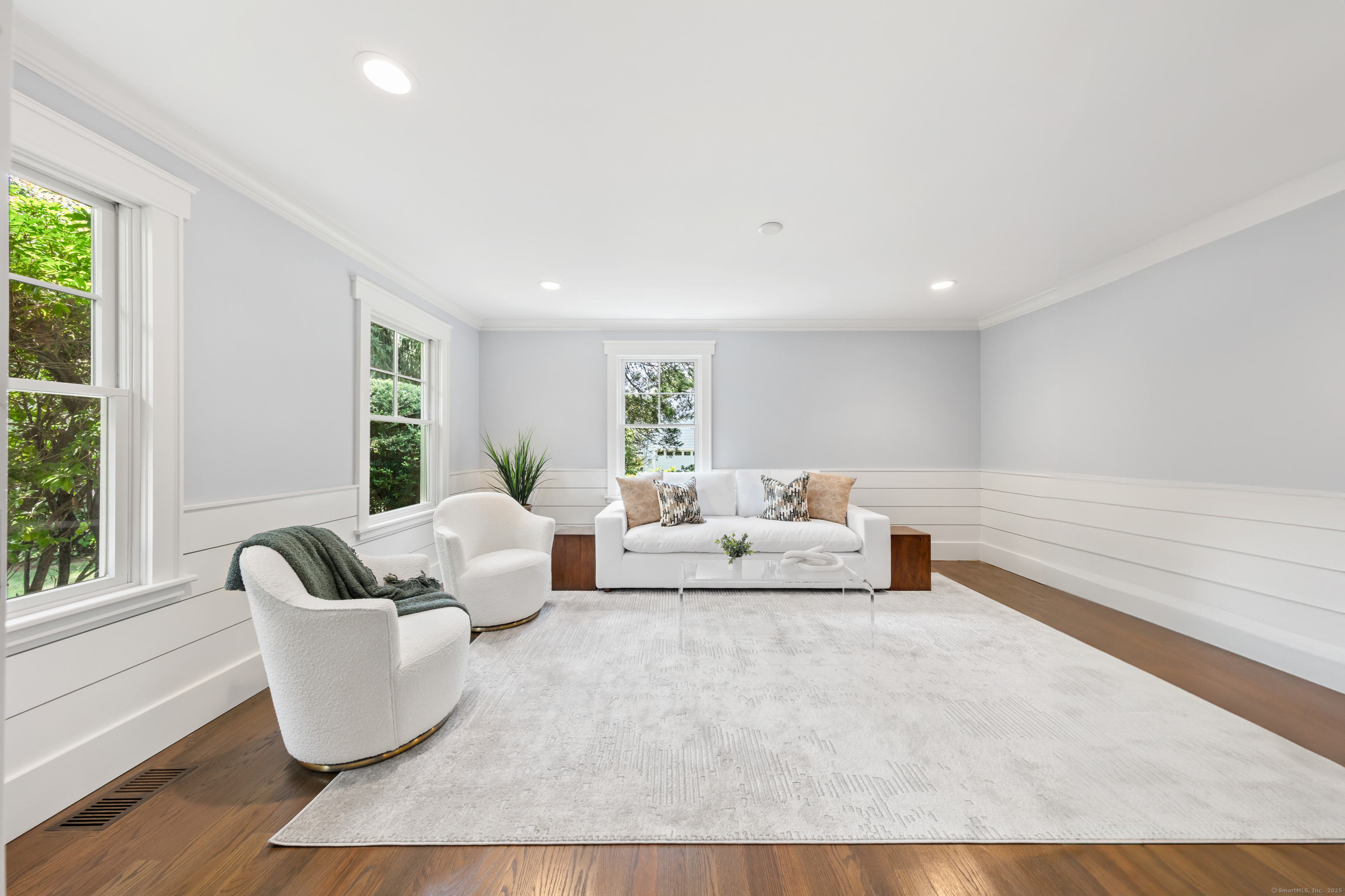 358 Hoyt Street Darien, CT 06820 - Photo 14 of 40 a living room with furniture and a large window