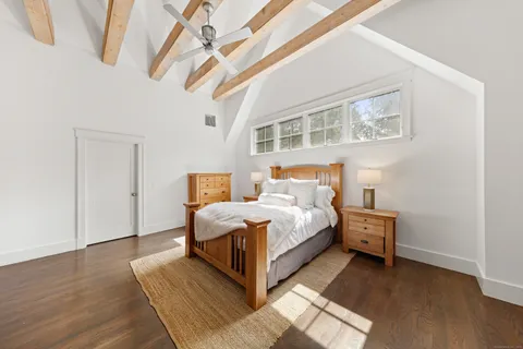 a bed room with a bed and a window