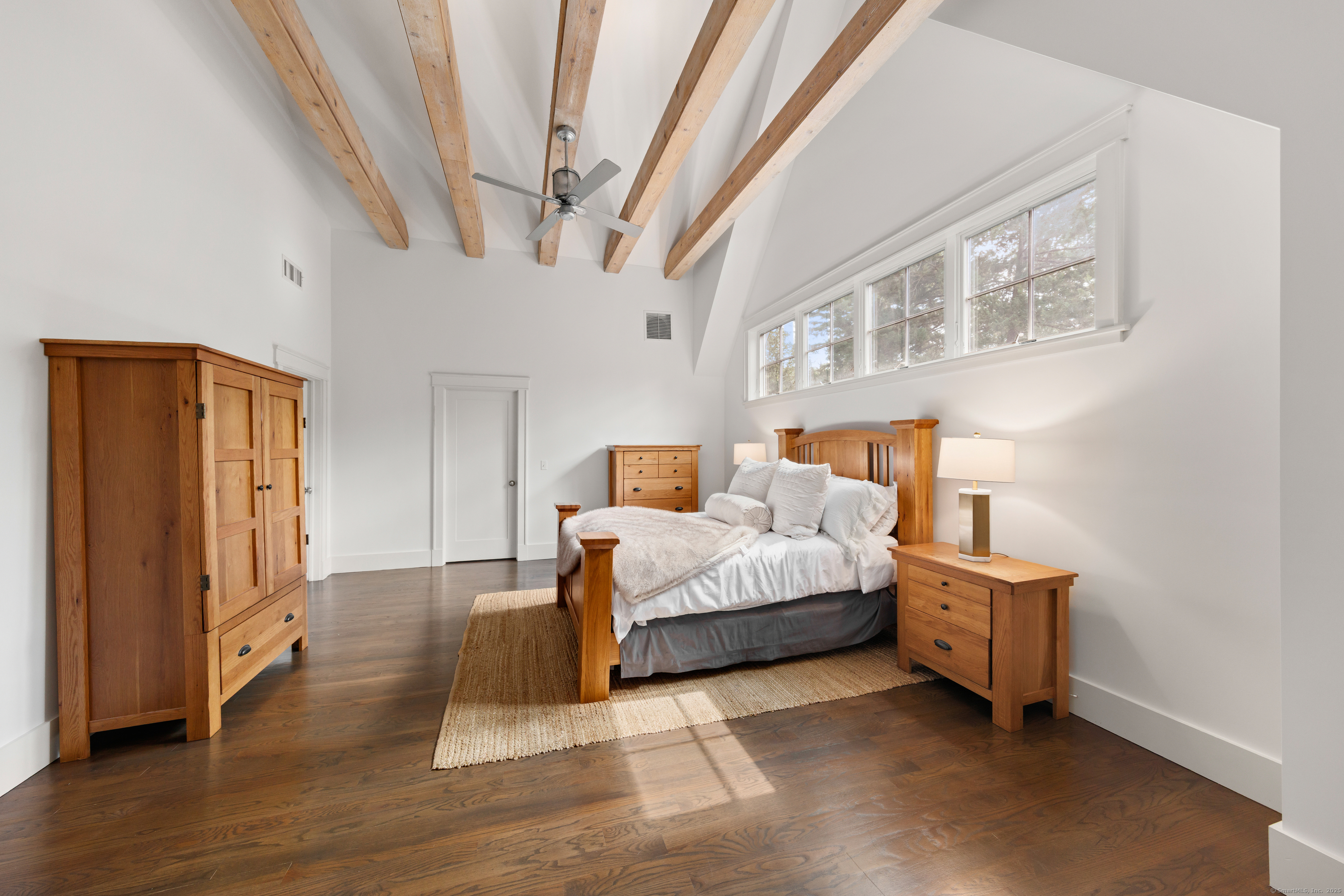 358 Hoyt Street Darien, CT 06820 - Photo 26 of 40 a bedroom with a bed and a large window