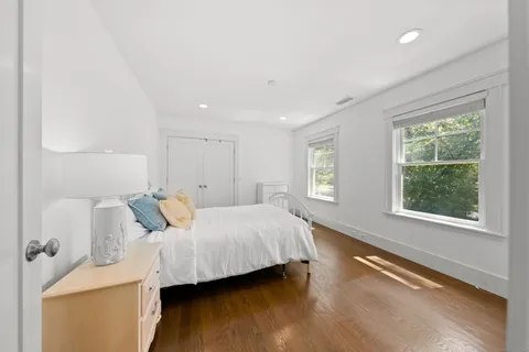 a room with a bed and a window
