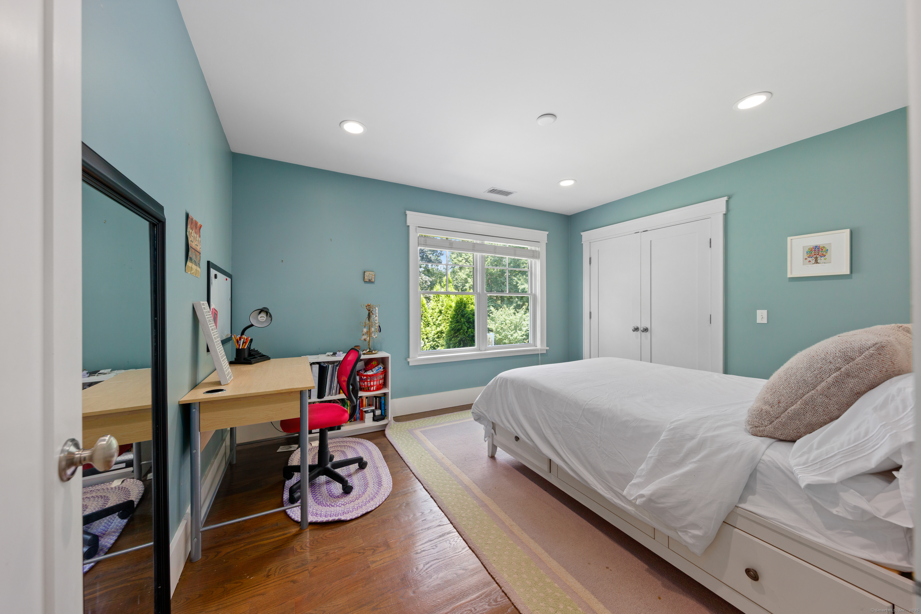 358 Hoyt Street Darien, CT 06820 - Photo 31 of 40 a bedroom with a bed and large windows