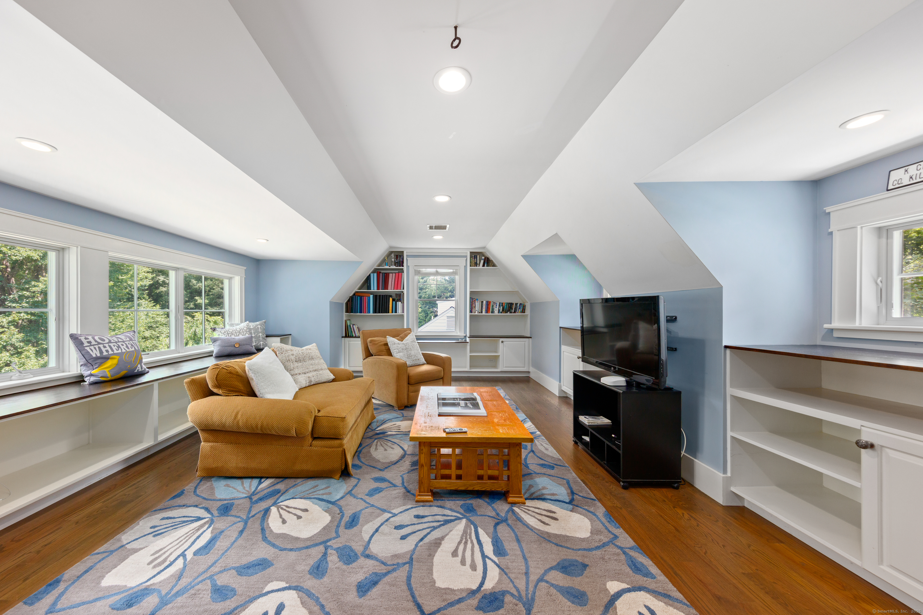 358 Hoyt Street Darien, CT 06820 - Photo 32 of 40 a living room with furniture and a flat screen tv