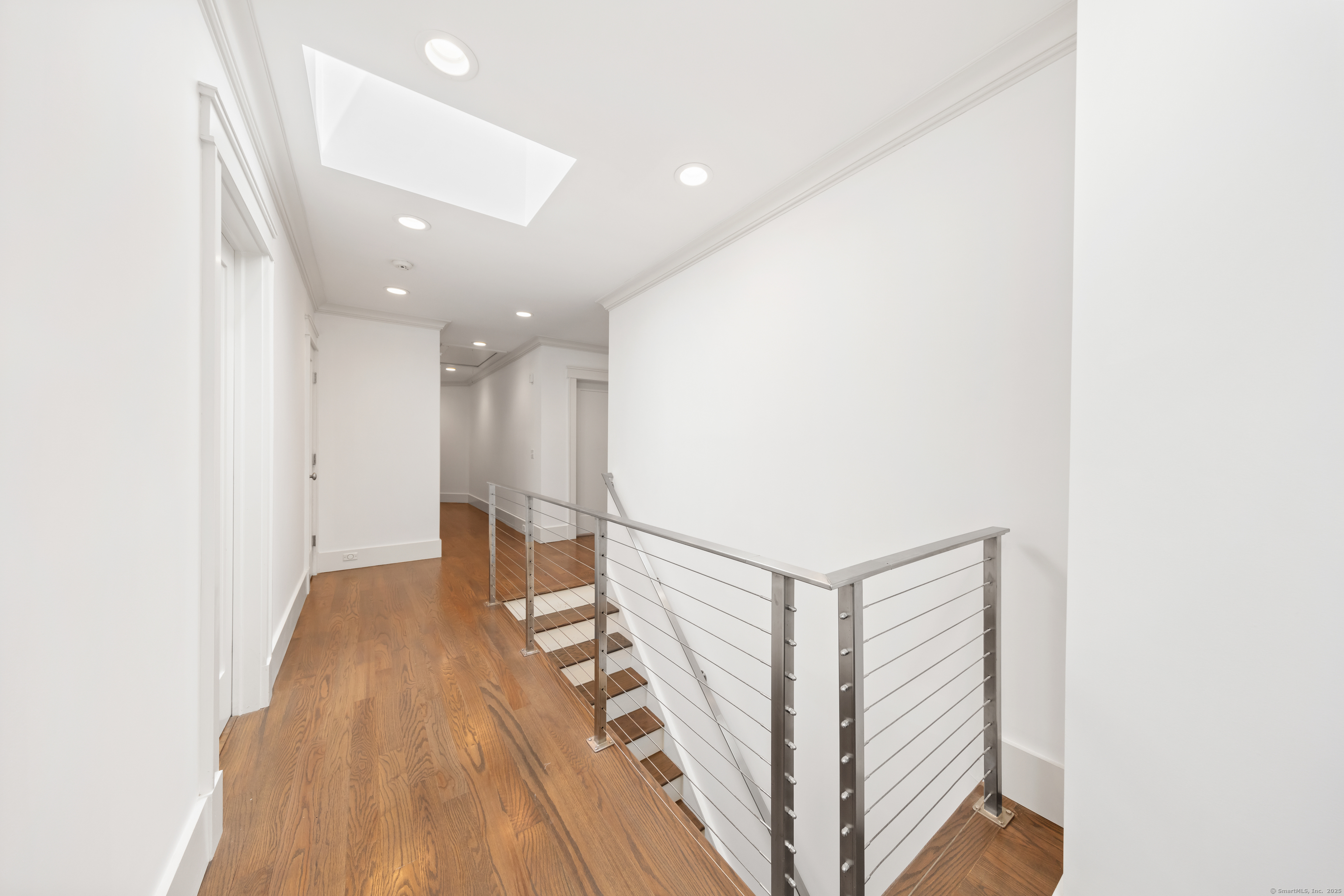 358 Hoyt Street Darien, CT 06820 - Photo 34 of 40 a view of a hallway with staircase