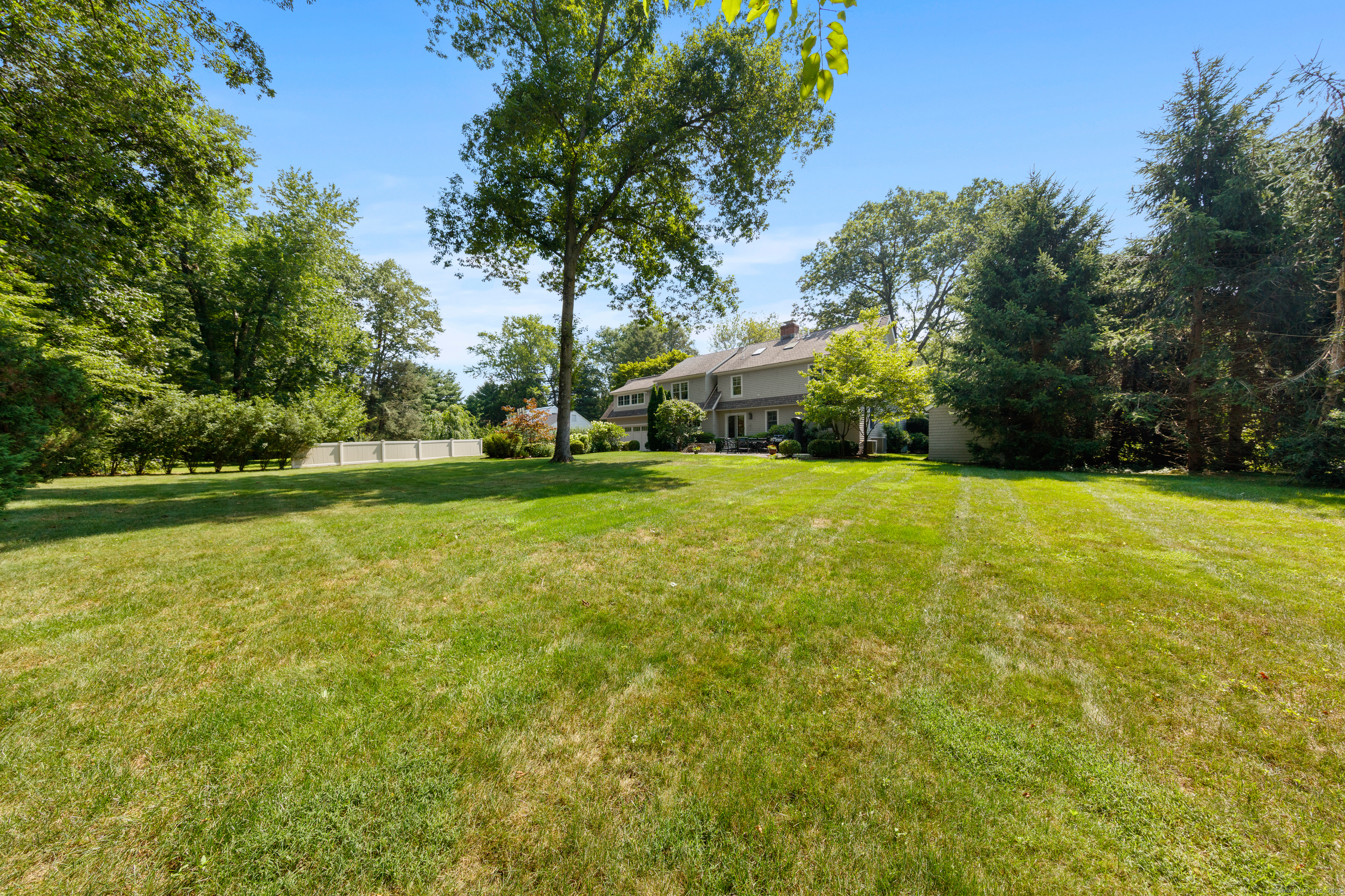 358 Hoyt Street Darien, CT 06820 - Photo 39 of 40 a view of green field with trees in the background