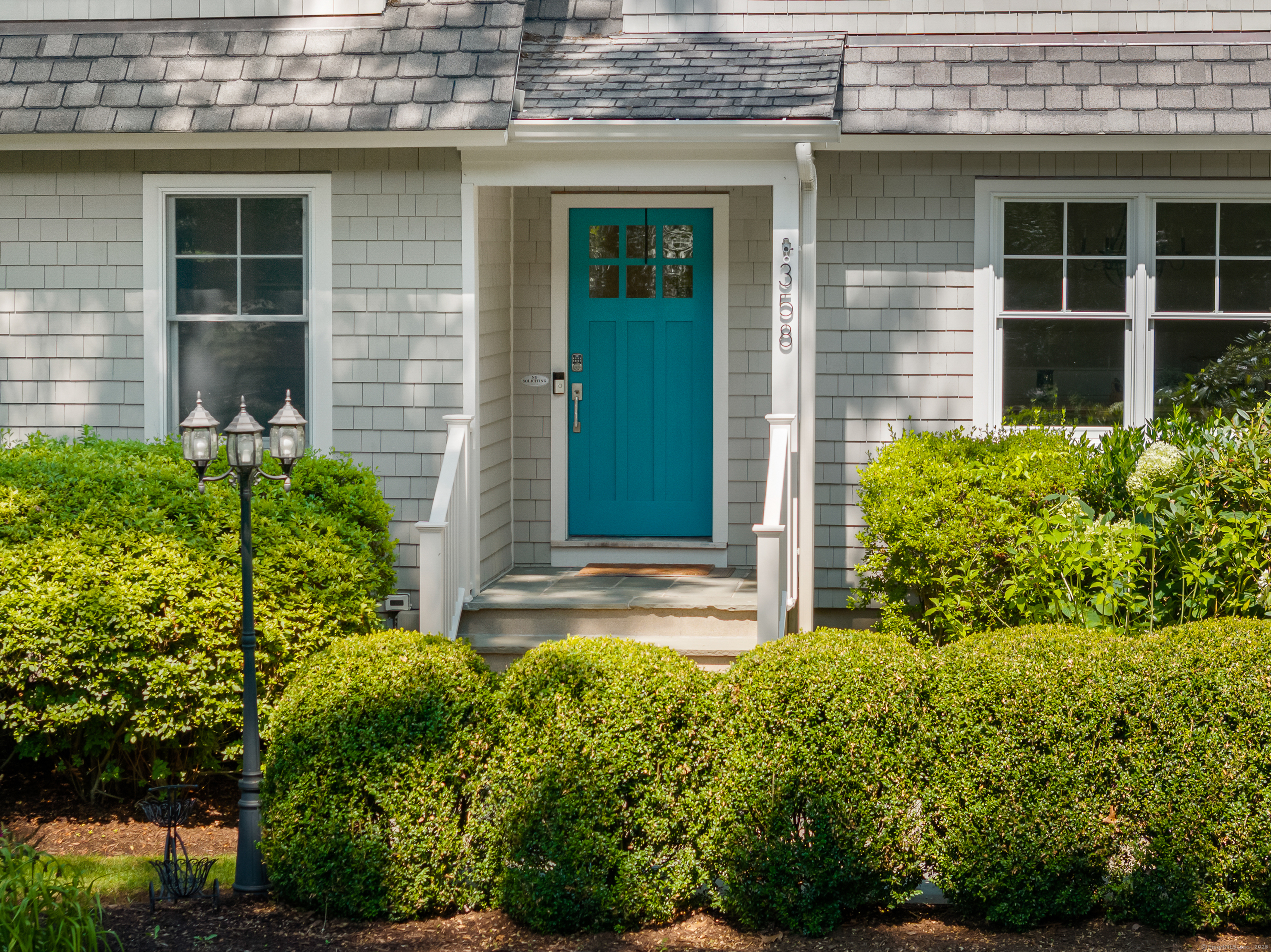 358 Hoyt Street Darien, CT 06820 - Photo 6 of 40 a view of a house with potted plants