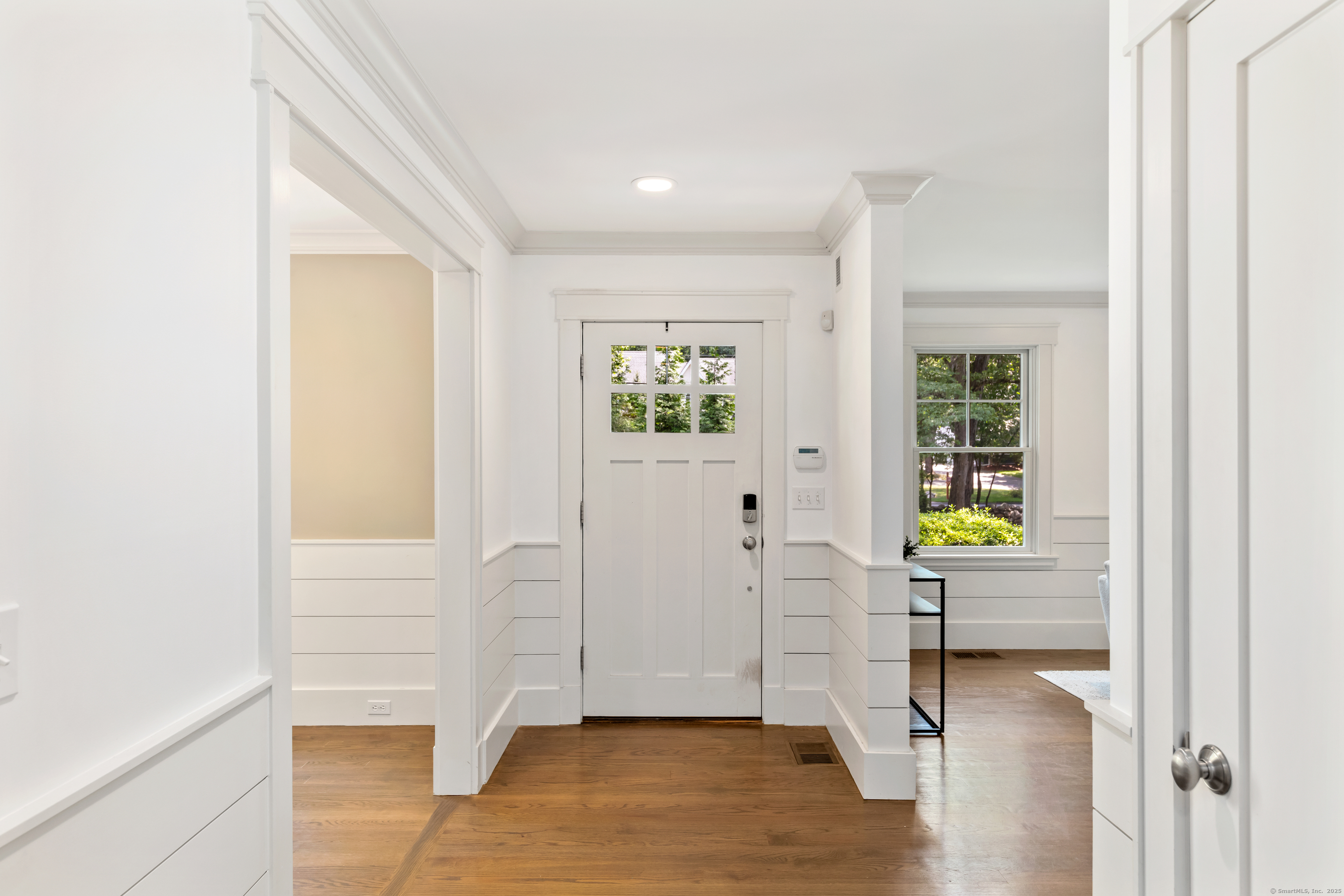 358 Hoyt Street Darien, CT 06820 - Photo 7 of 40 a view of an entryway with wooden floor