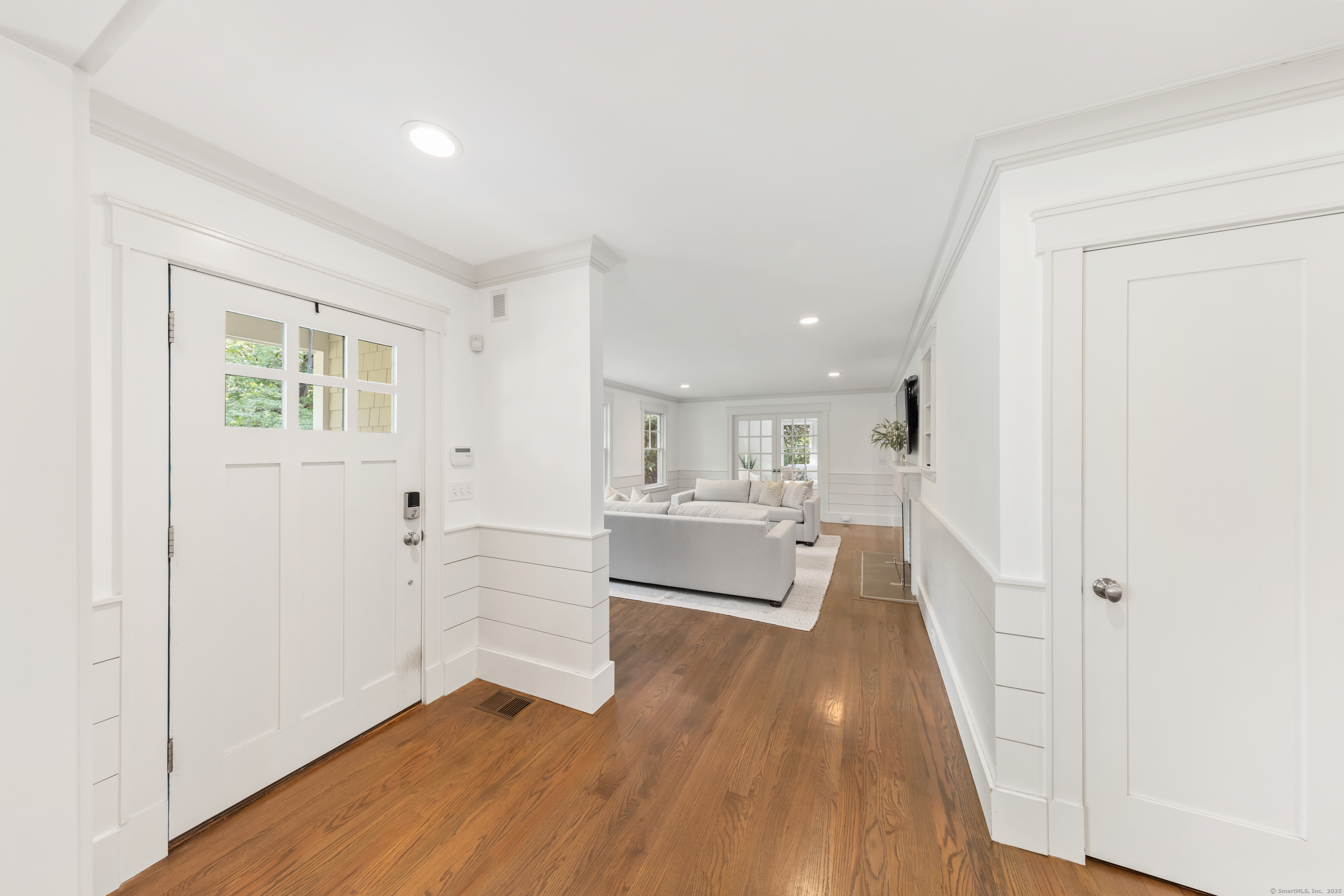 358 Hoyt Street Darien, CT 06820 - Photo 8 of 40 a view of empty room with wooden floor and window