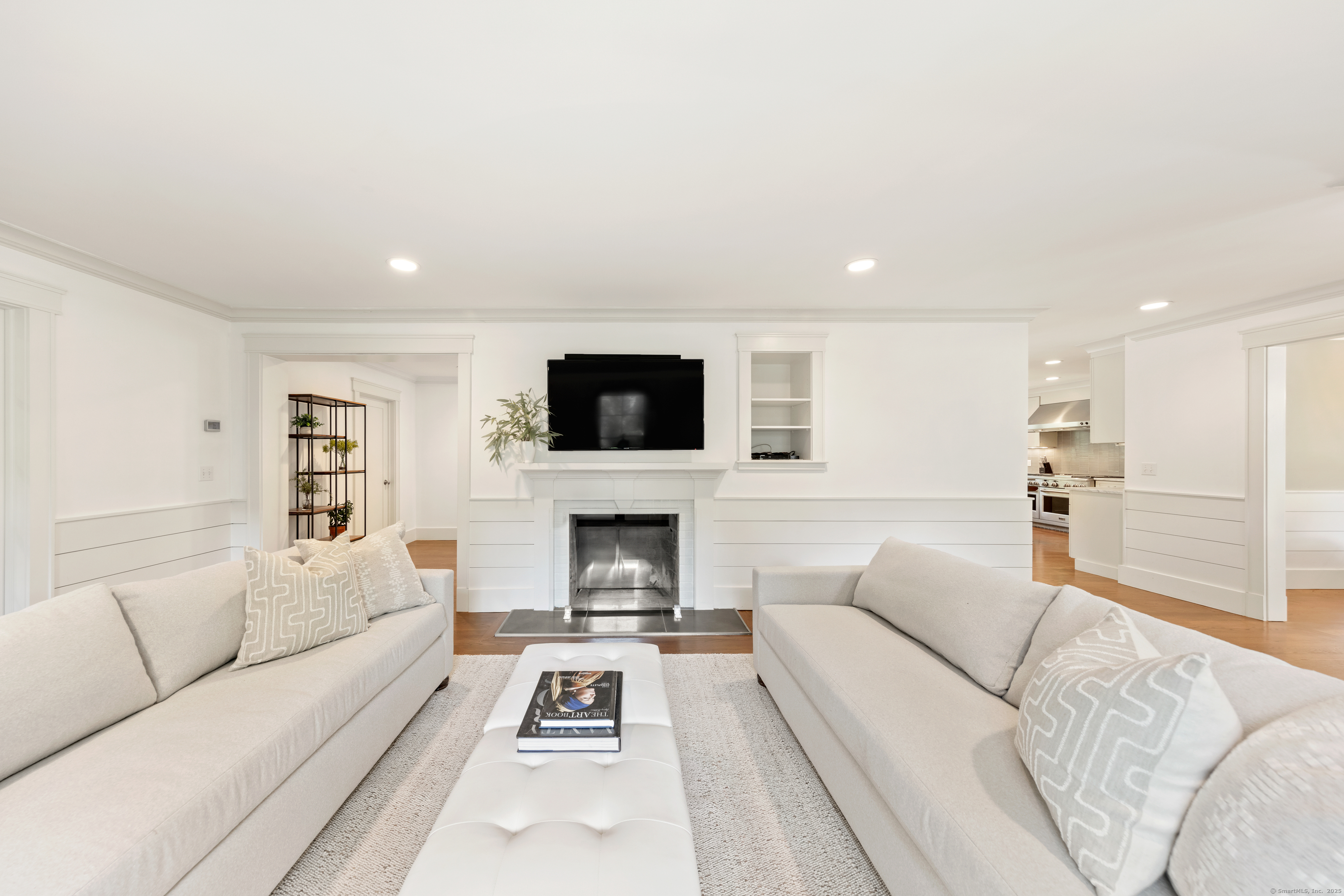 358 Hoyt Street Darien, CT 06820 - Photo 9 of 40 a living room with furniture and a flat screen tv