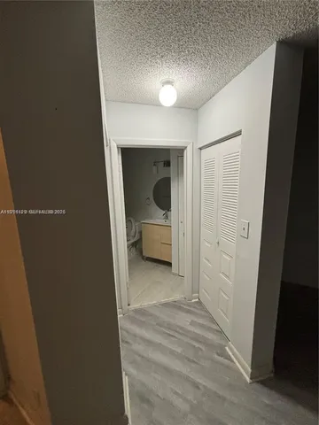 a view of a bathroom from a hallway