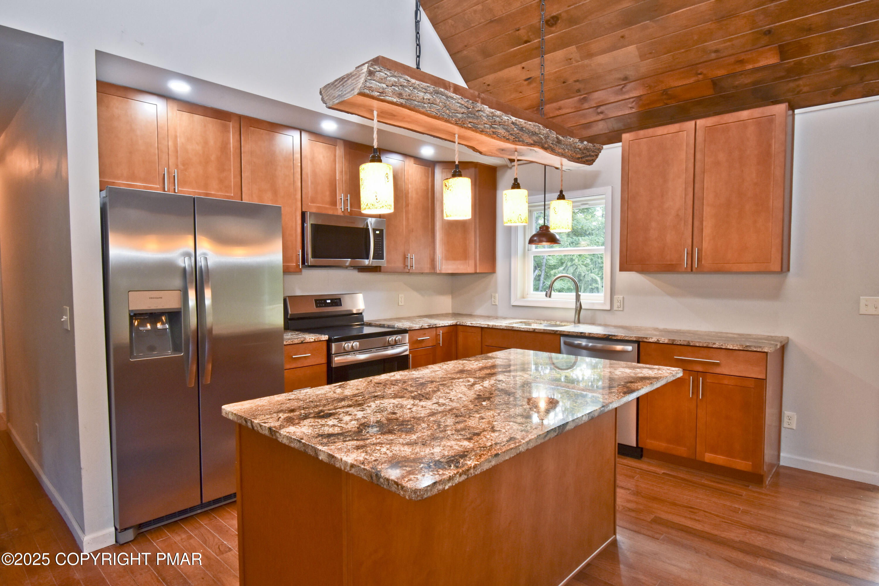 348 Summit Road Swiftwater, PA 18370 - Photo 11 of 47 a kitchen with stainless steel appliances granite countertop a sink stove and refrigerator