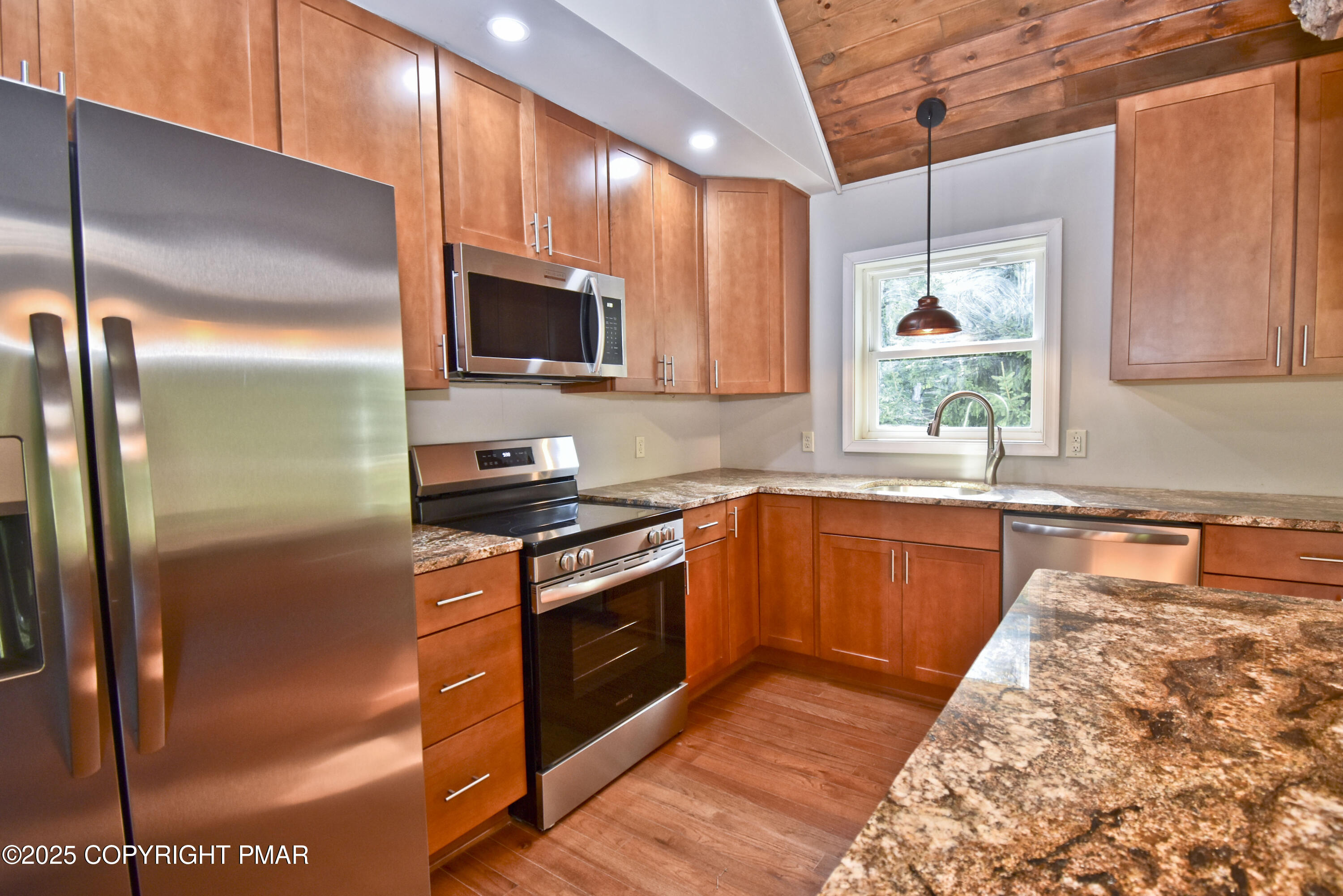 348 Summit Road Swiftwater, PA 18370 - Photo 13 of 47 a kitchen with stainless steel appliances granite countertop a stove a sink and a refrigerator