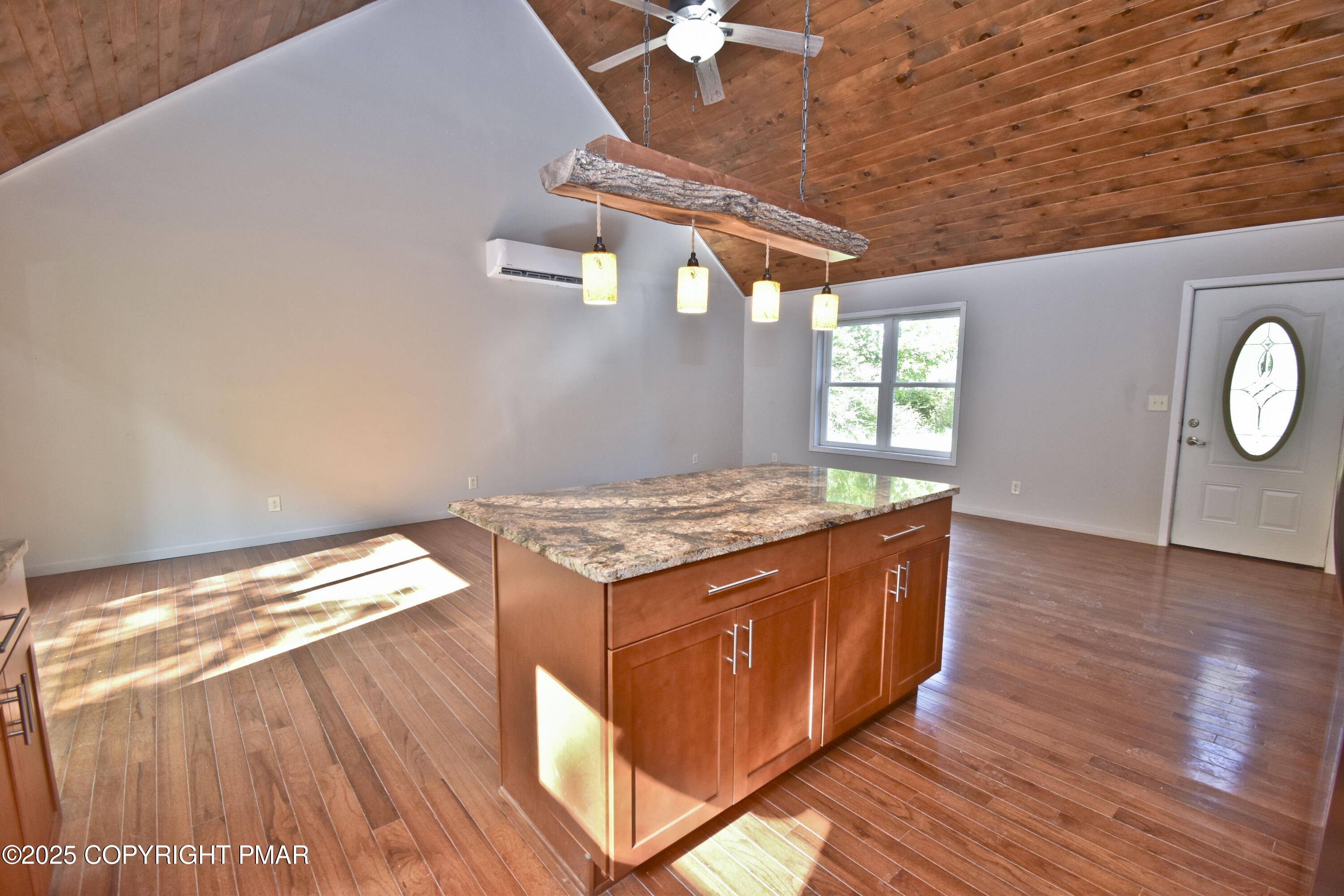 348 Summit Road Swiftwater, PA 18370 - Photo 15 of 47 a kitchen with granite countertop a stove and a wooden floors