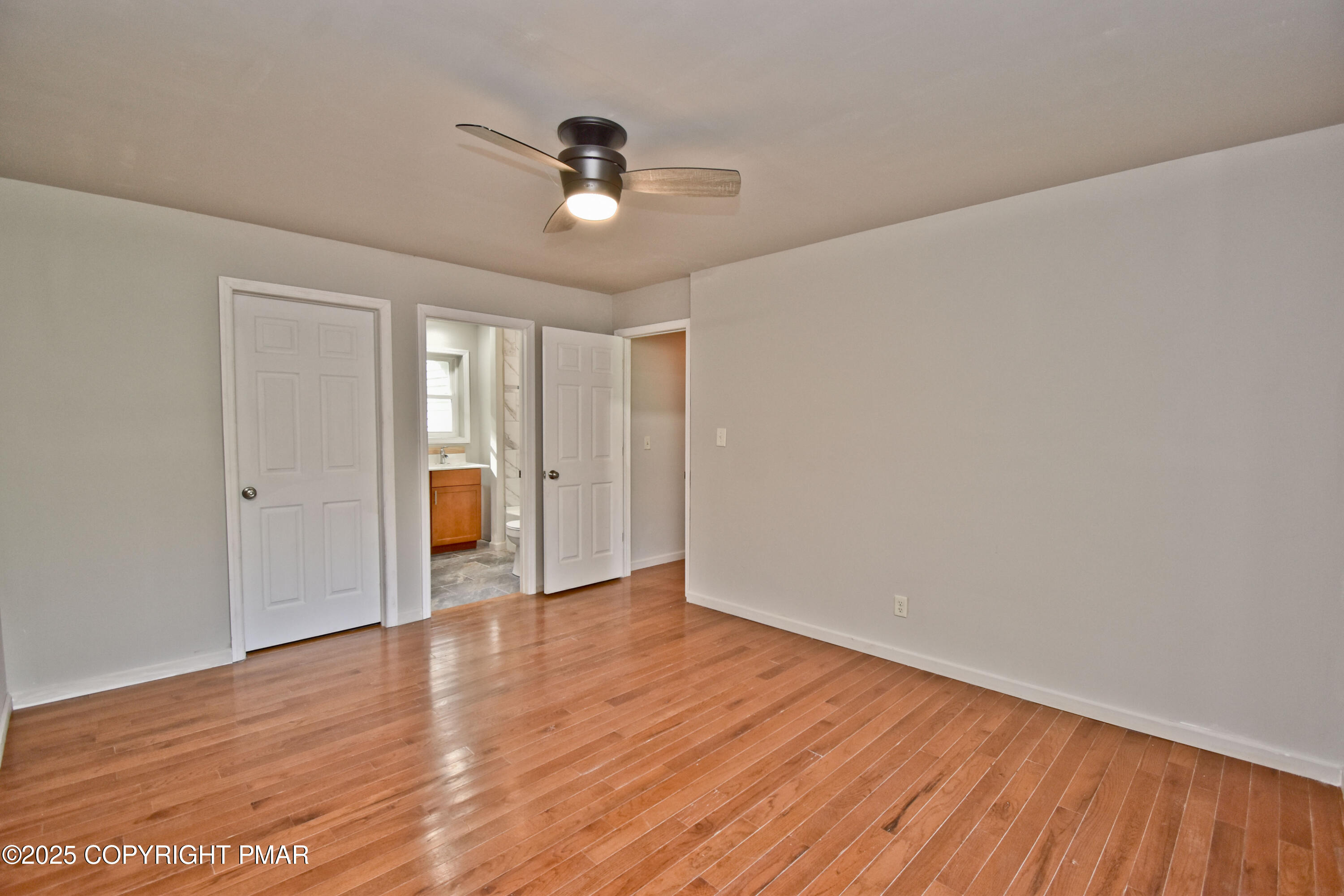 348 Summit Road Swiftwater, PA 18370 - Photo 18 of 47 a view of an empty room with wooden floor and a window