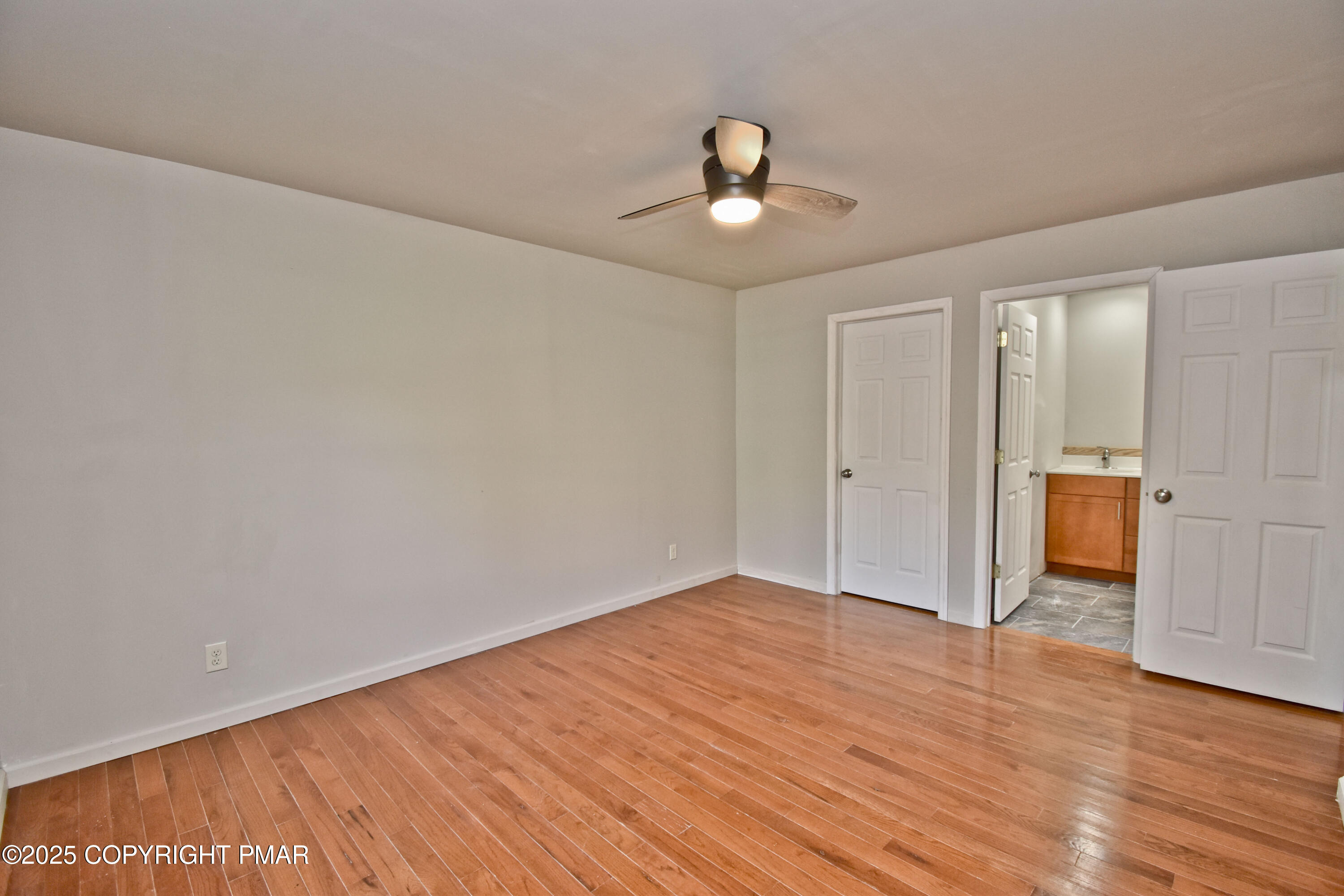 348 Summit Road Swiftwater, PA 18370 - Photo 19 of 47 a view of an empty room with wooden floor