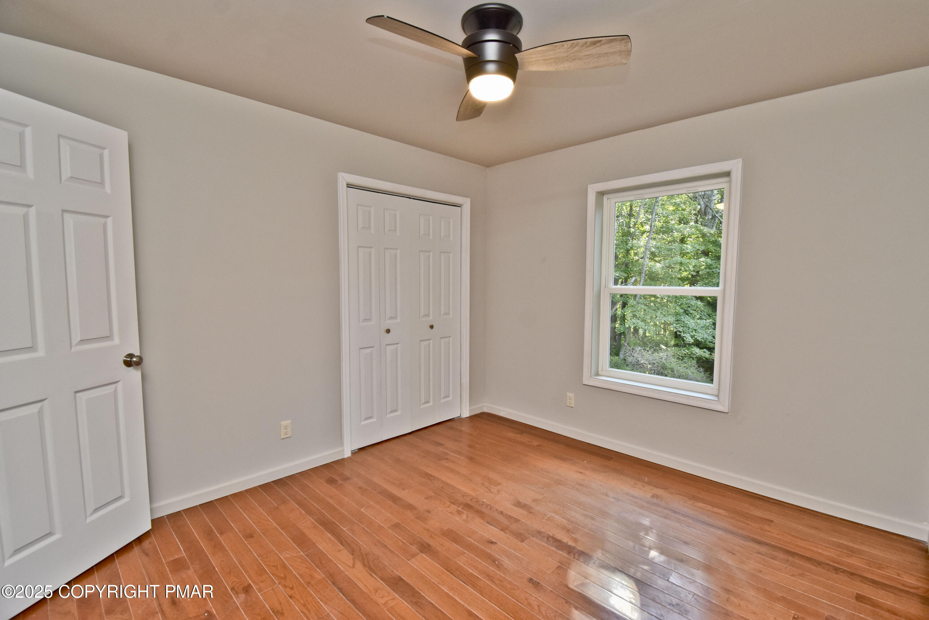 348 Summit Road Swiftwater, PA 18370 - Photo 24 of 47 wooden floor in an empty room with a window