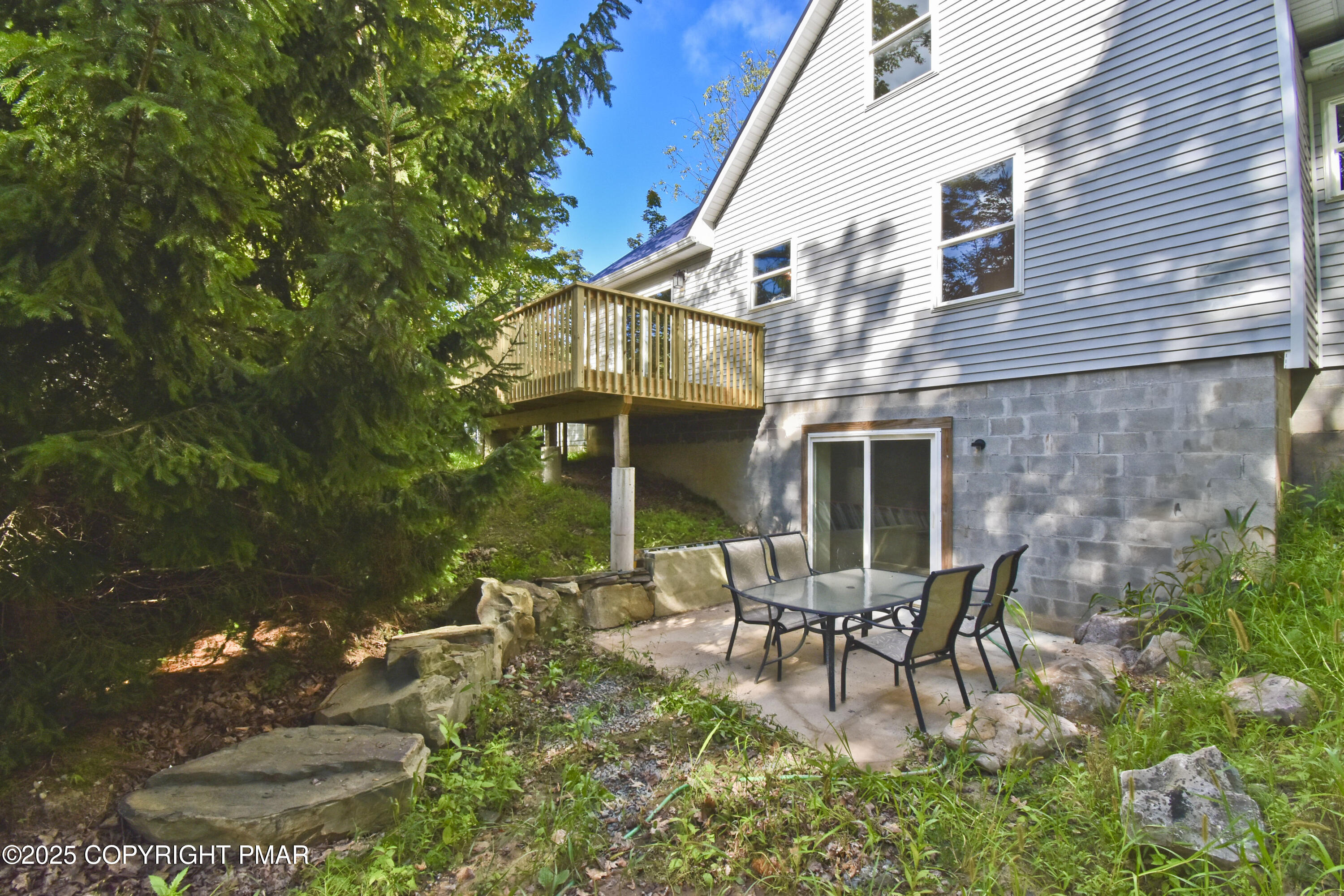 348 Summit Road Swiftwater, PA 18370 - Photo 35 of 47 a view of a house with backyard and sitting area