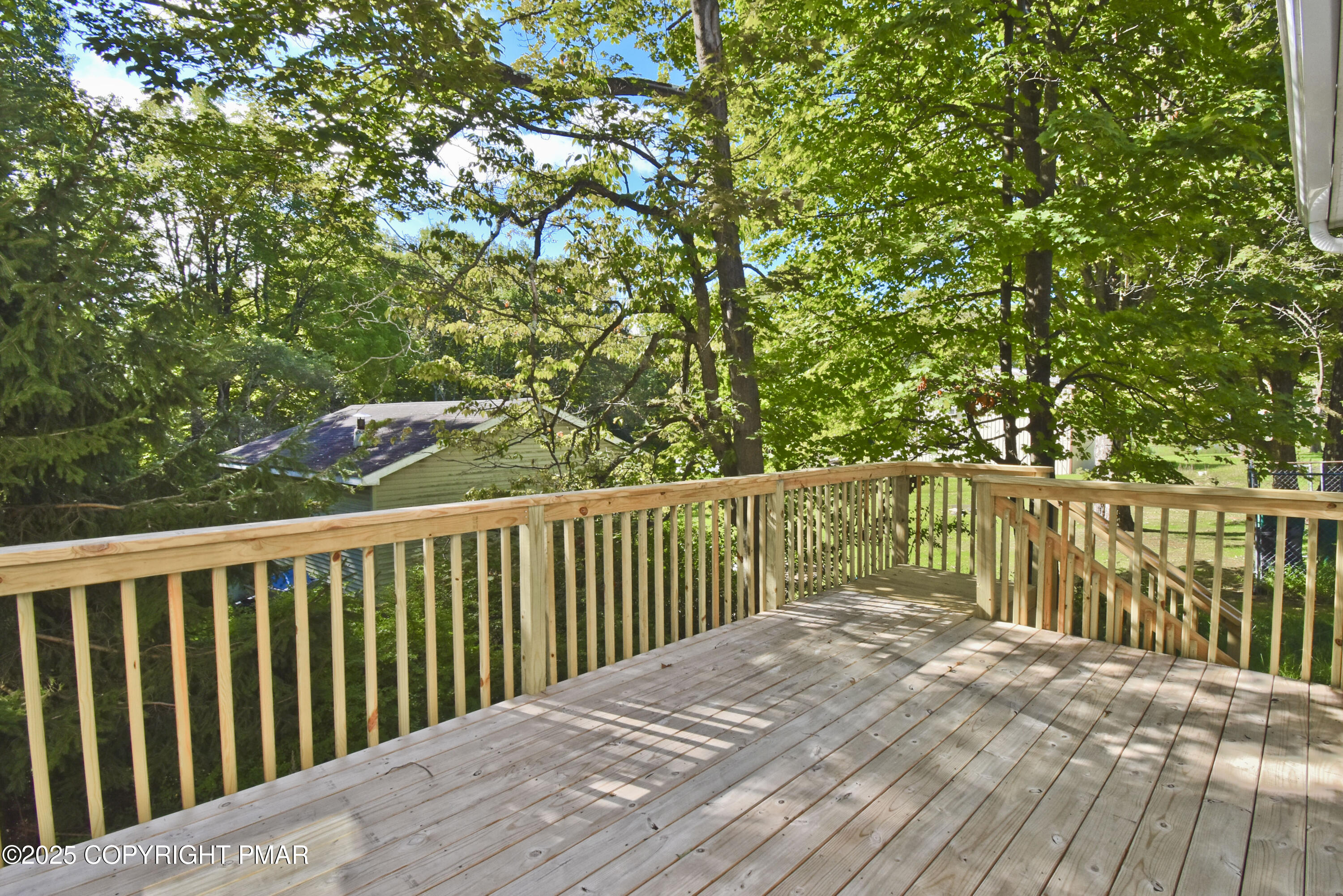348 Summit Road Swiftwater, PA 18370 - Photo 37 of 47 a balcony with wooden floor and fence