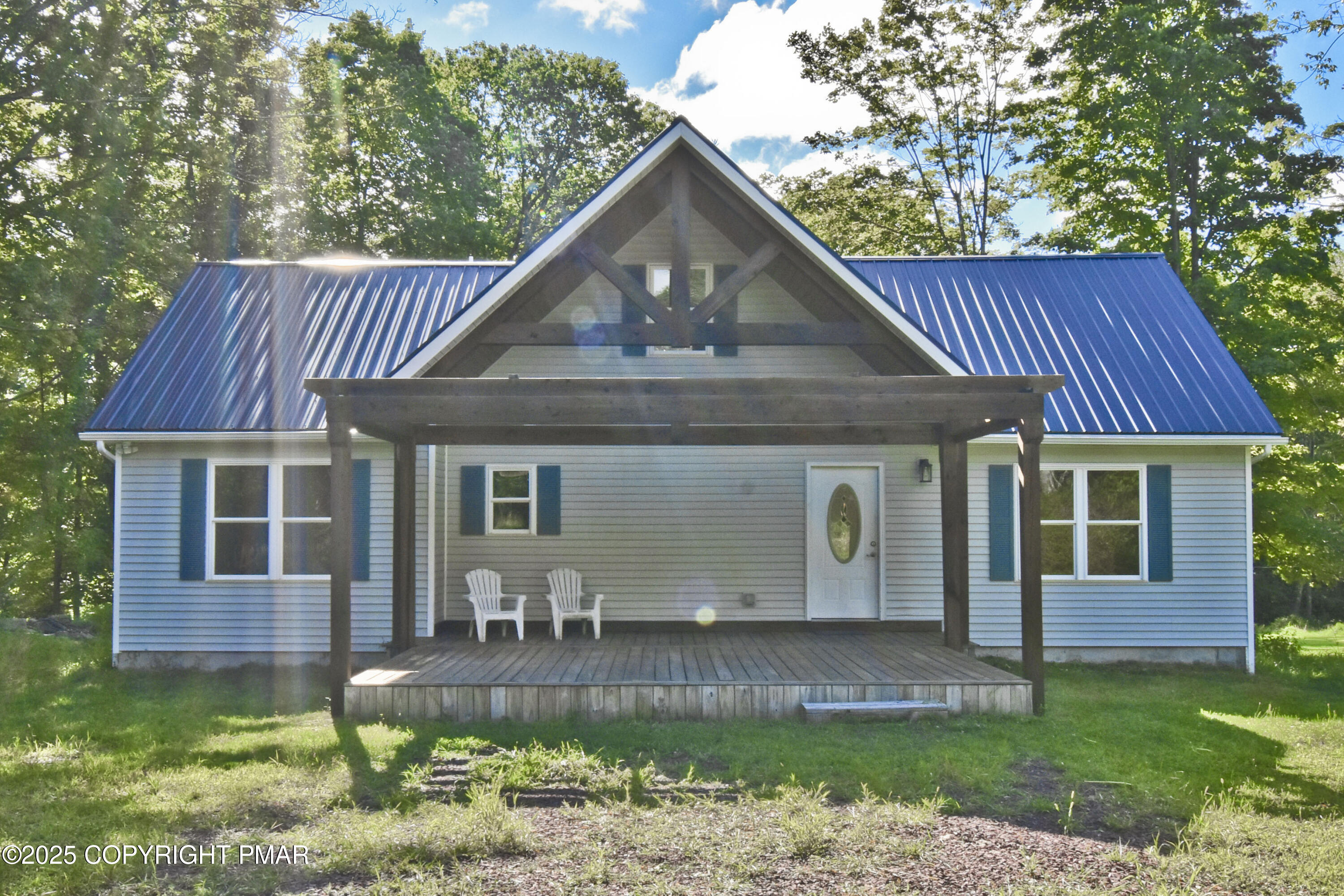 348 Summit Road Swiftwater, PA 18370 - Photo 40 of 47 a front view of a house with garden