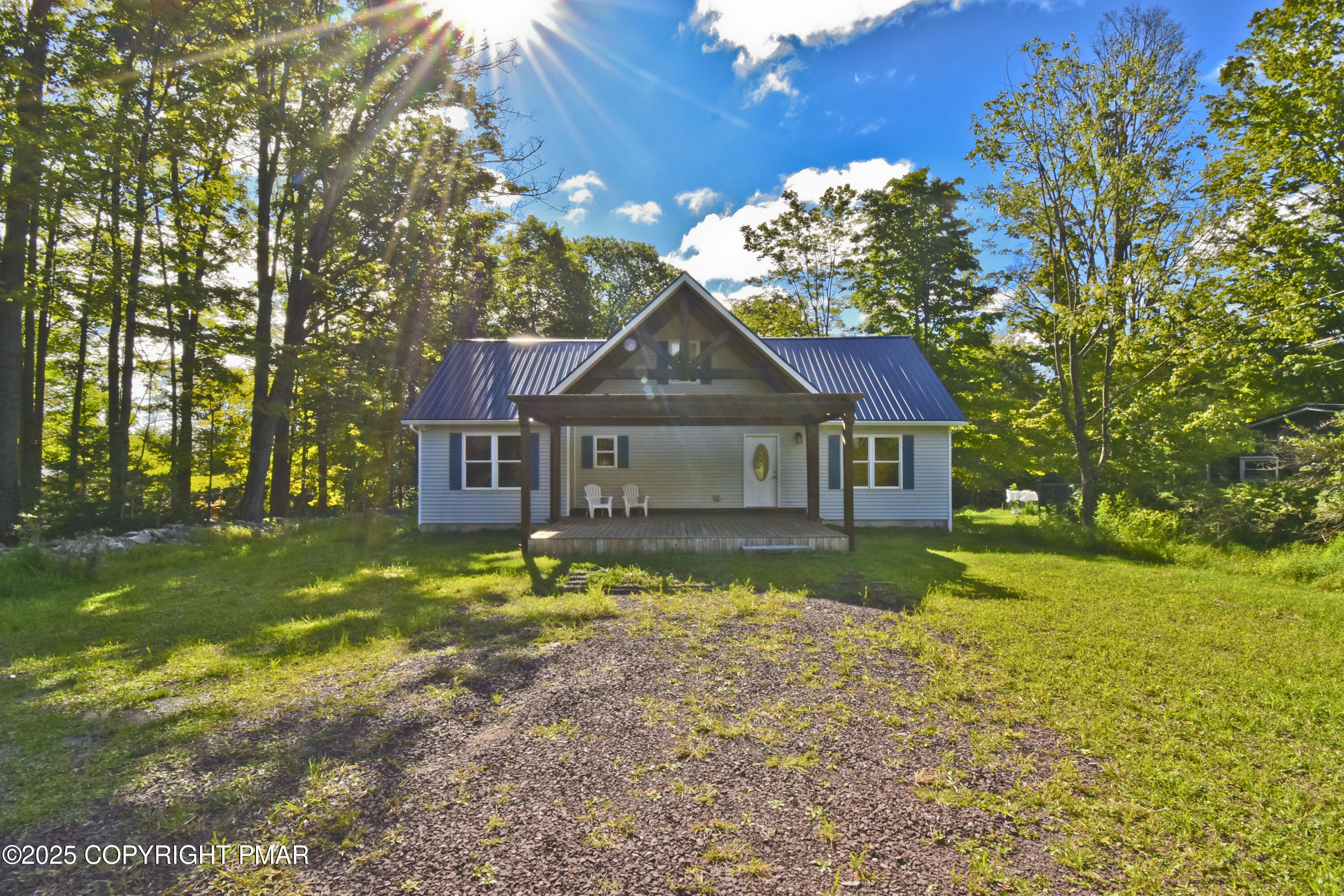 348 Summit Road Swiftwater, PA 18370 - Photo 41 of 47 a front view of a house with a yard