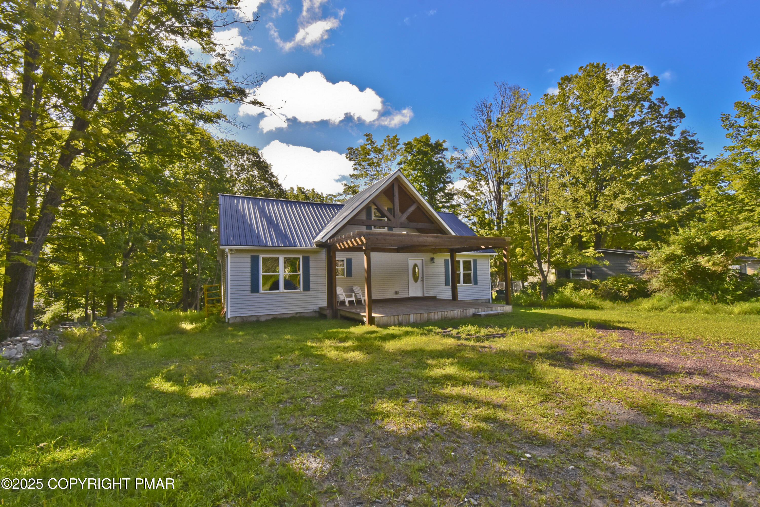 348 Summit Road Swiftwater, PA 18370 - Photo 42 of 47 a house view with a garden space