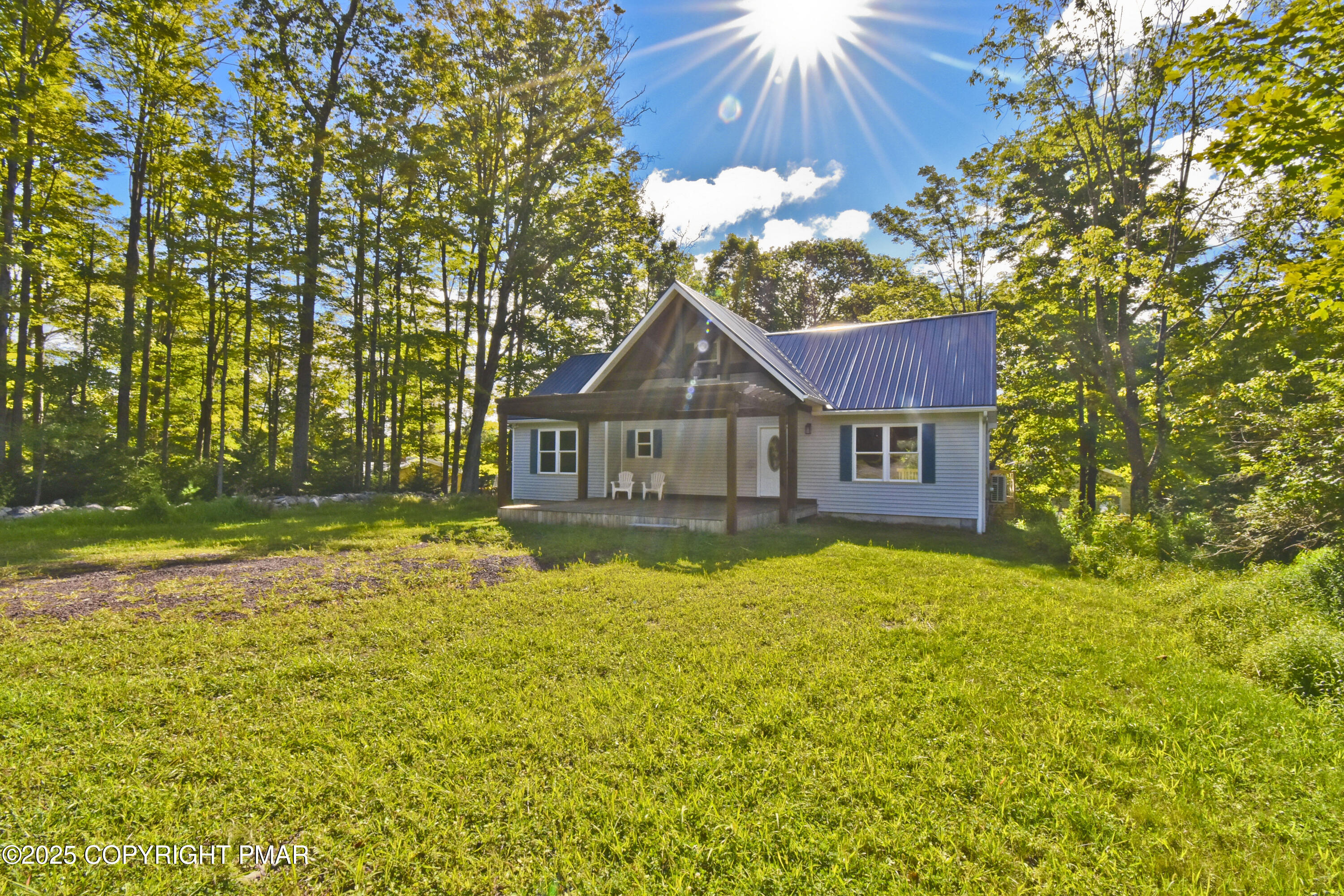 348 Summit Road Swiftwater, PA 18370 - Photo 43 of 47 a front view of a house with yard and swimming pool