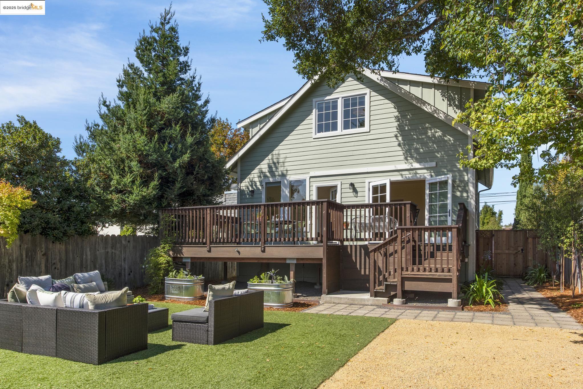 1630 Derby Street Berkeley, CA 94703 - Photo 1 of 1 a view of a house with a backyard and a patio