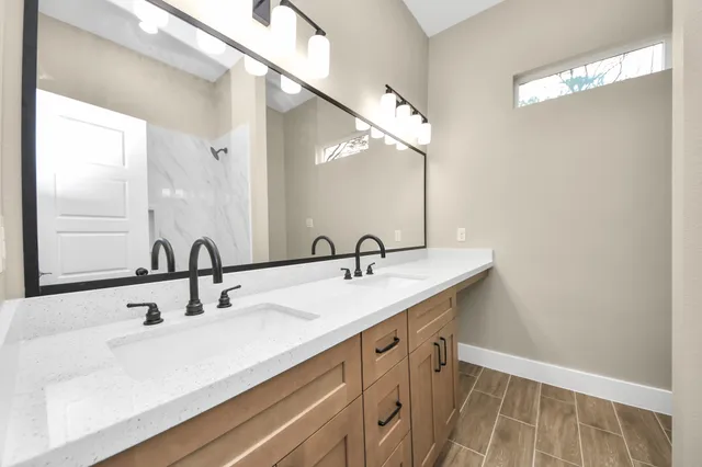 a bathroom with a sink and a mirror