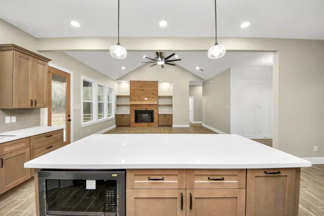a kitchen with a table and chairs
