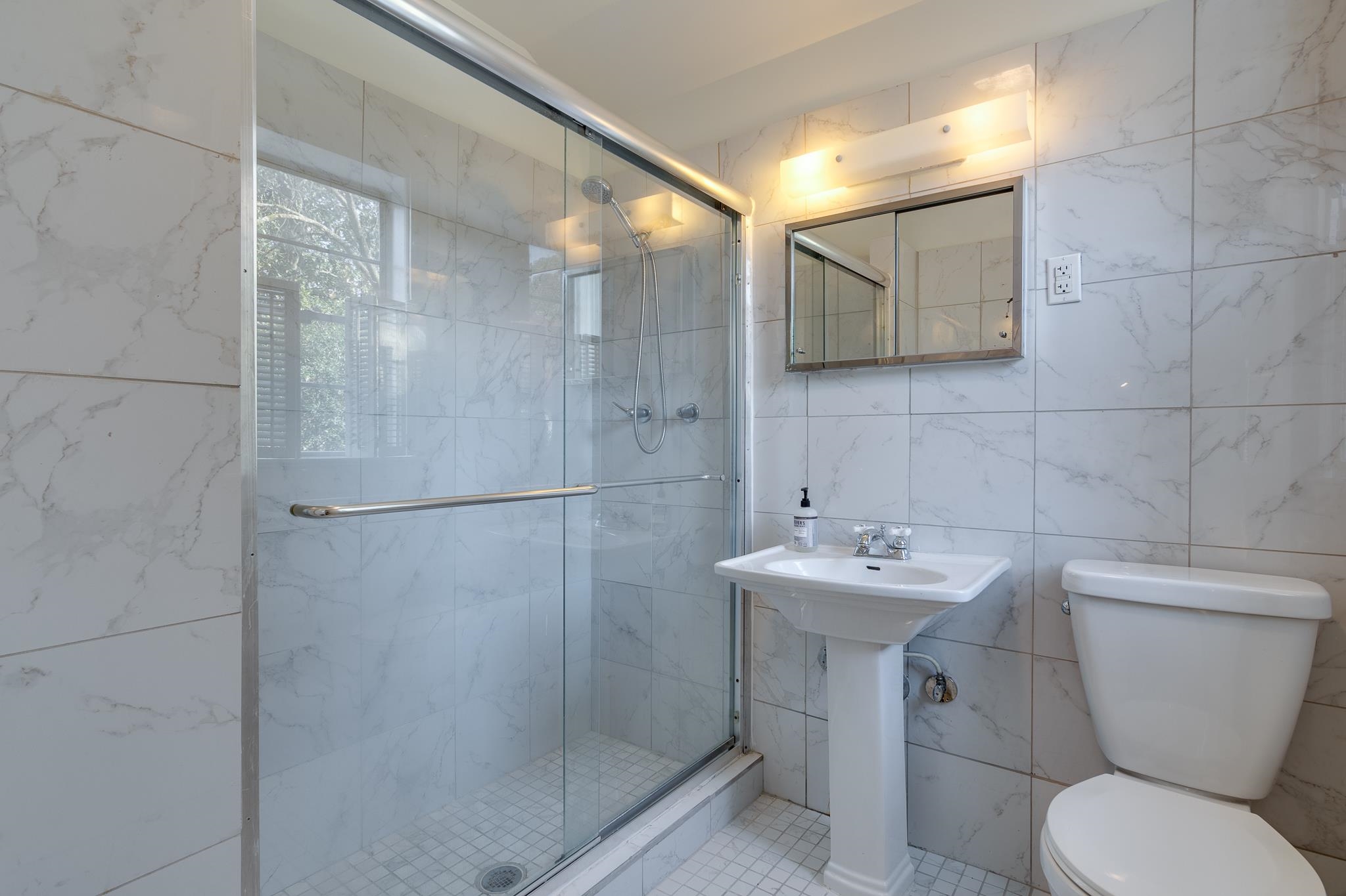 2929 Central Avenue Memphis, TN 38111 - Photo 22 of 25 a bathroom with a sink toilet and shower