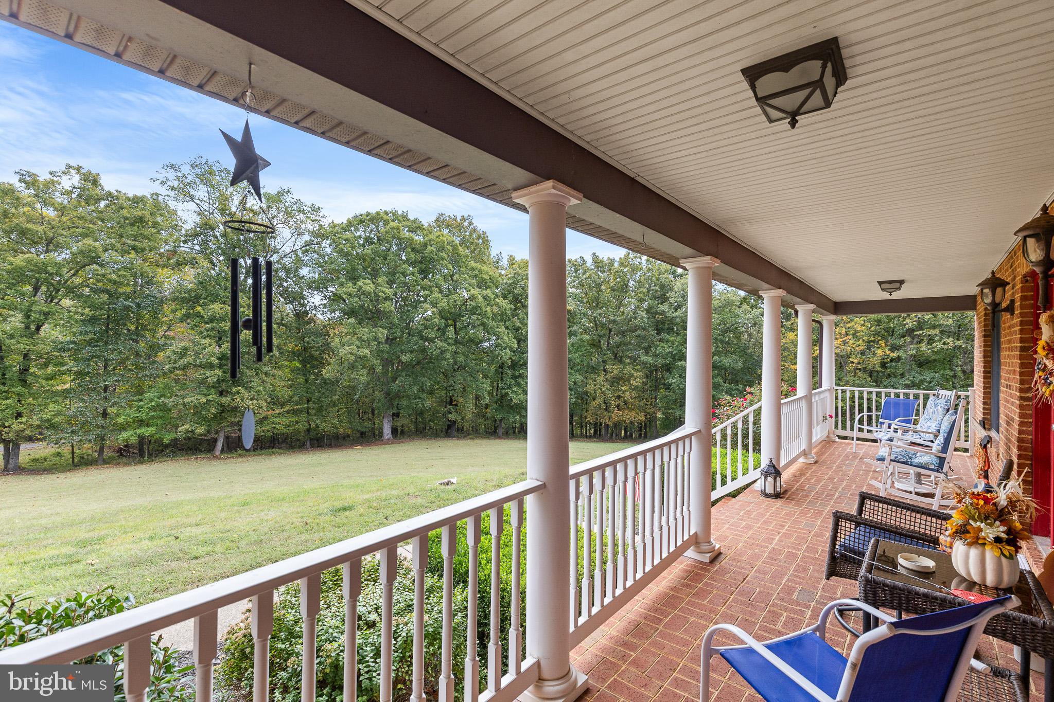 21246 Clarks Mountain Road Rapidan, VA 22733 - Photo 32 of 38 a view of a porch with furniture and backyard