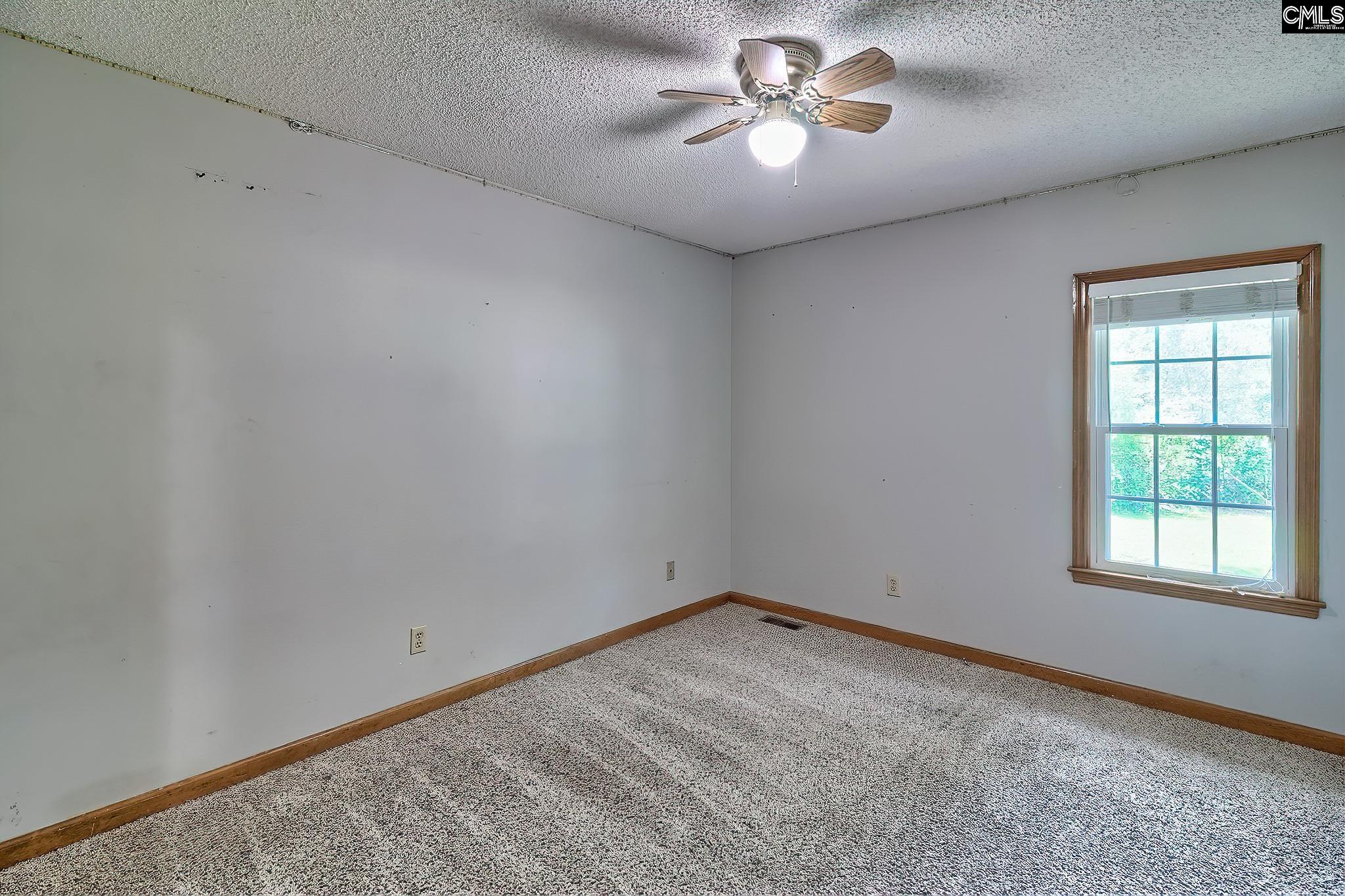1415 State Rd S-28-55 Lugoff, SC 29078 - Photo 24 of 39 an empty room with a window