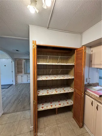 a kitchen with stainless steel appliances granite countertop a refrigerator and a stove