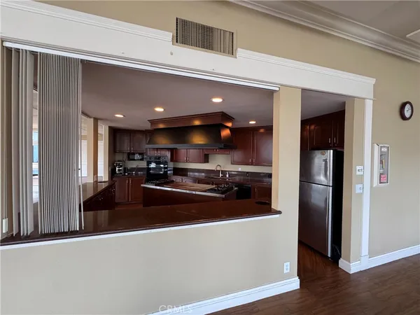 a swimming pool with large glass windows and city view