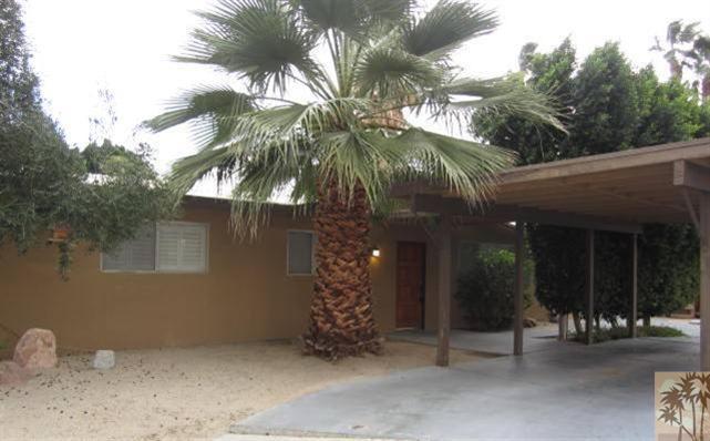 70160 Chappel Road Rancho Mirage, CA 92270 - Photo 2 of 11 a couple of palm trees in front of house
